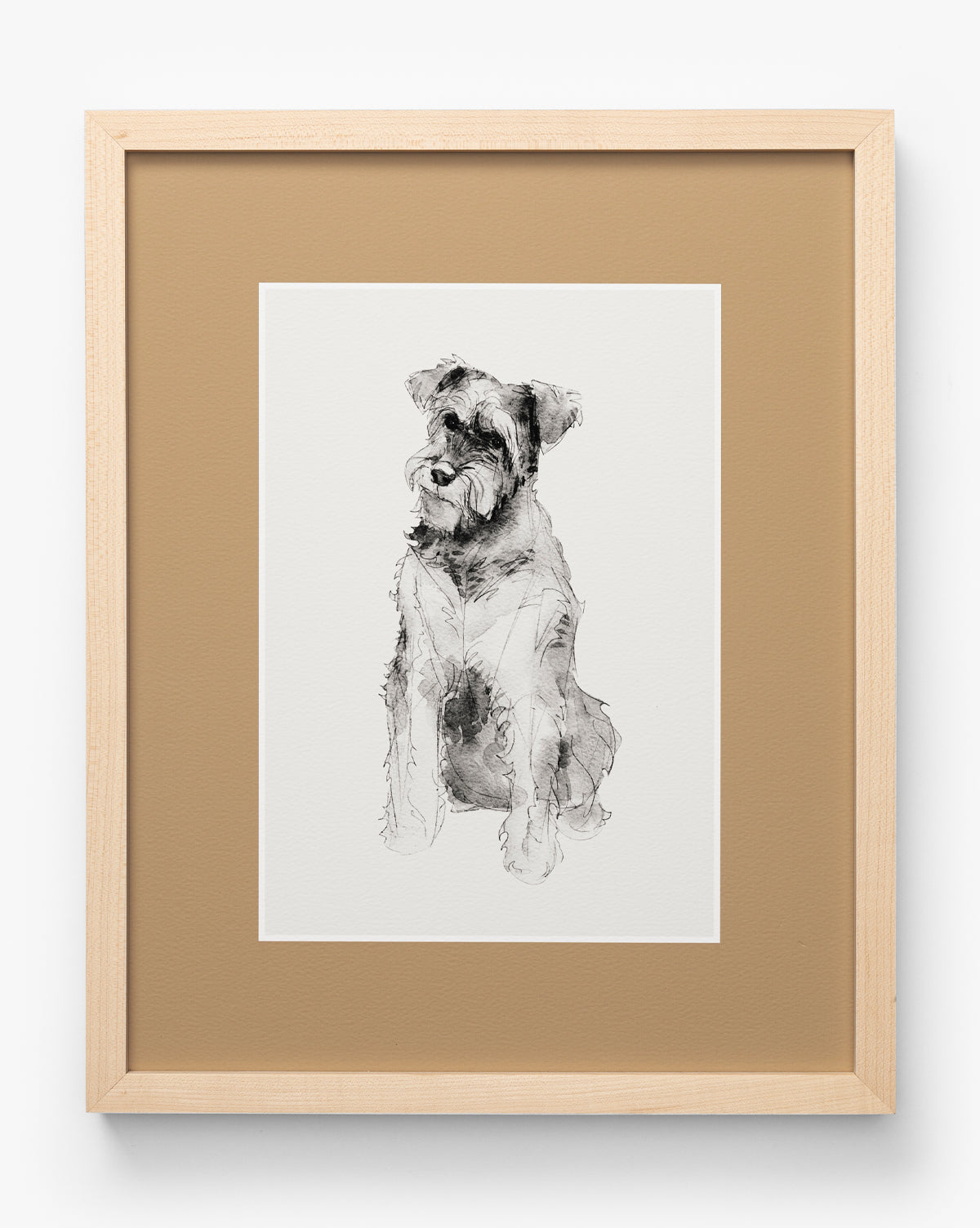 Rex is a framed artwork featuring a black and white sketch of a terrier sitting sideways. Presented in a maple frame with a tan mat, its perfect as nursery wall art, by McGee & Co.