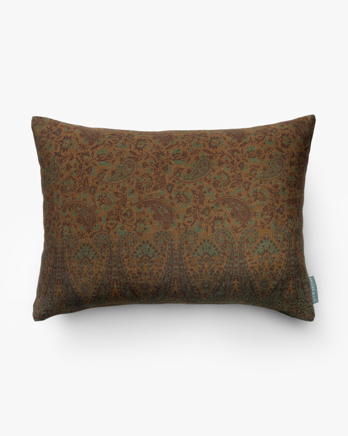 The Rosette Pillow Cover is a rectangular brown pillow cover with a subtle green and brown paisley and floral design, made from a soft cotton-linen blend, shown on a white background by McGee & Co.