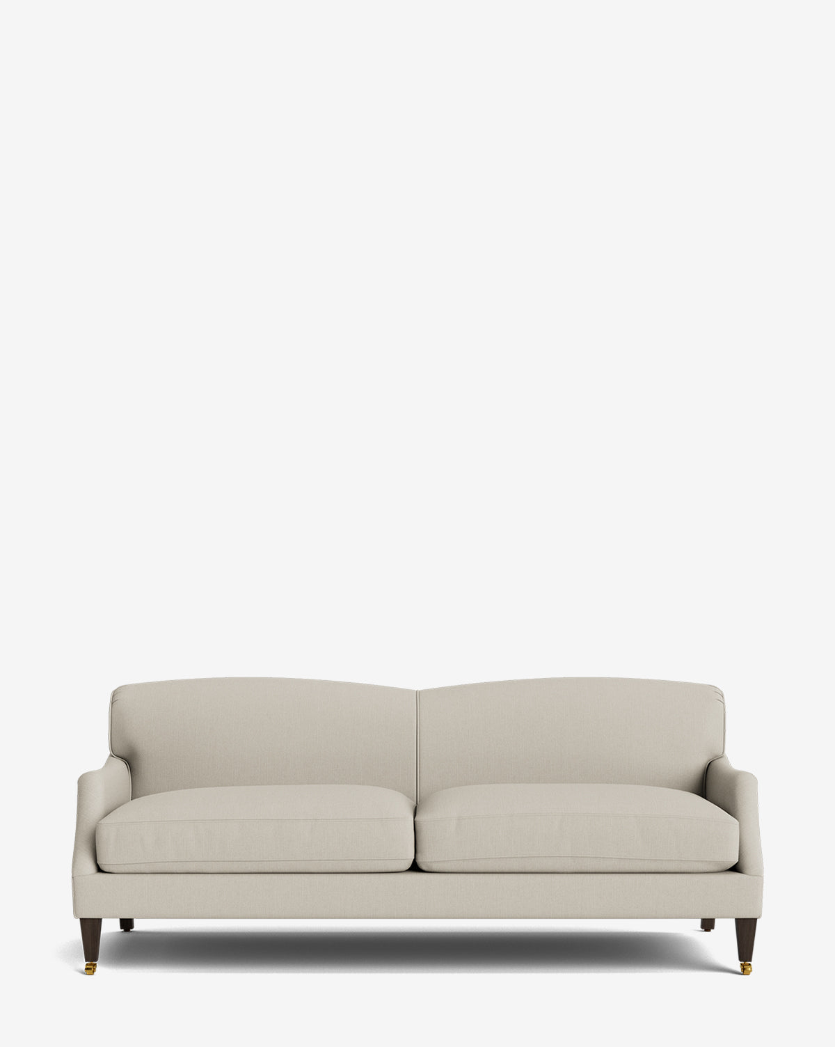 The Rowley Sofa 85 is a light beige, hand-crafted sofa with two seat cushions, a gently curved backrest, and dark wooden legs featuring gold caps, displayed against a plain white background, by McGee & Co.