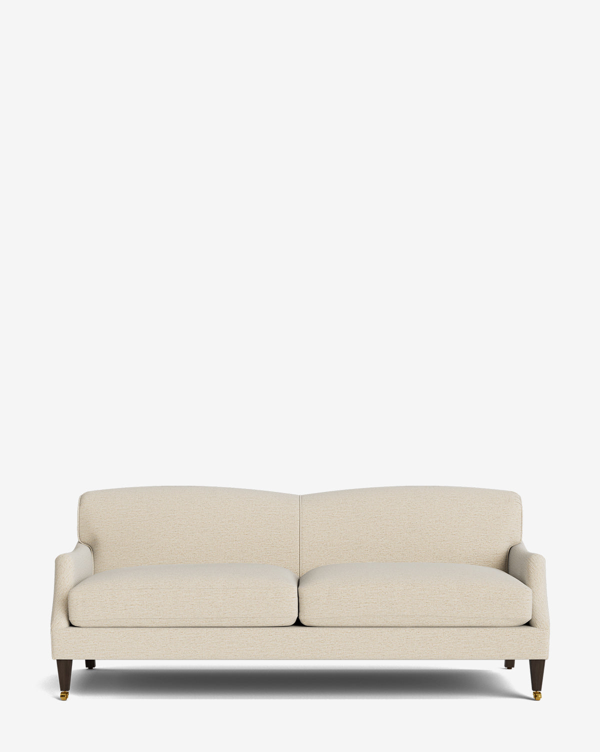 The Rowley Sofa 85 is a modern beige upholstered piece featuring two seat and back cushions, dark wooden legs, and brass casters. Hand-crafted, it blends timeless style with comfort and stands out against a white background by McGee & Co.