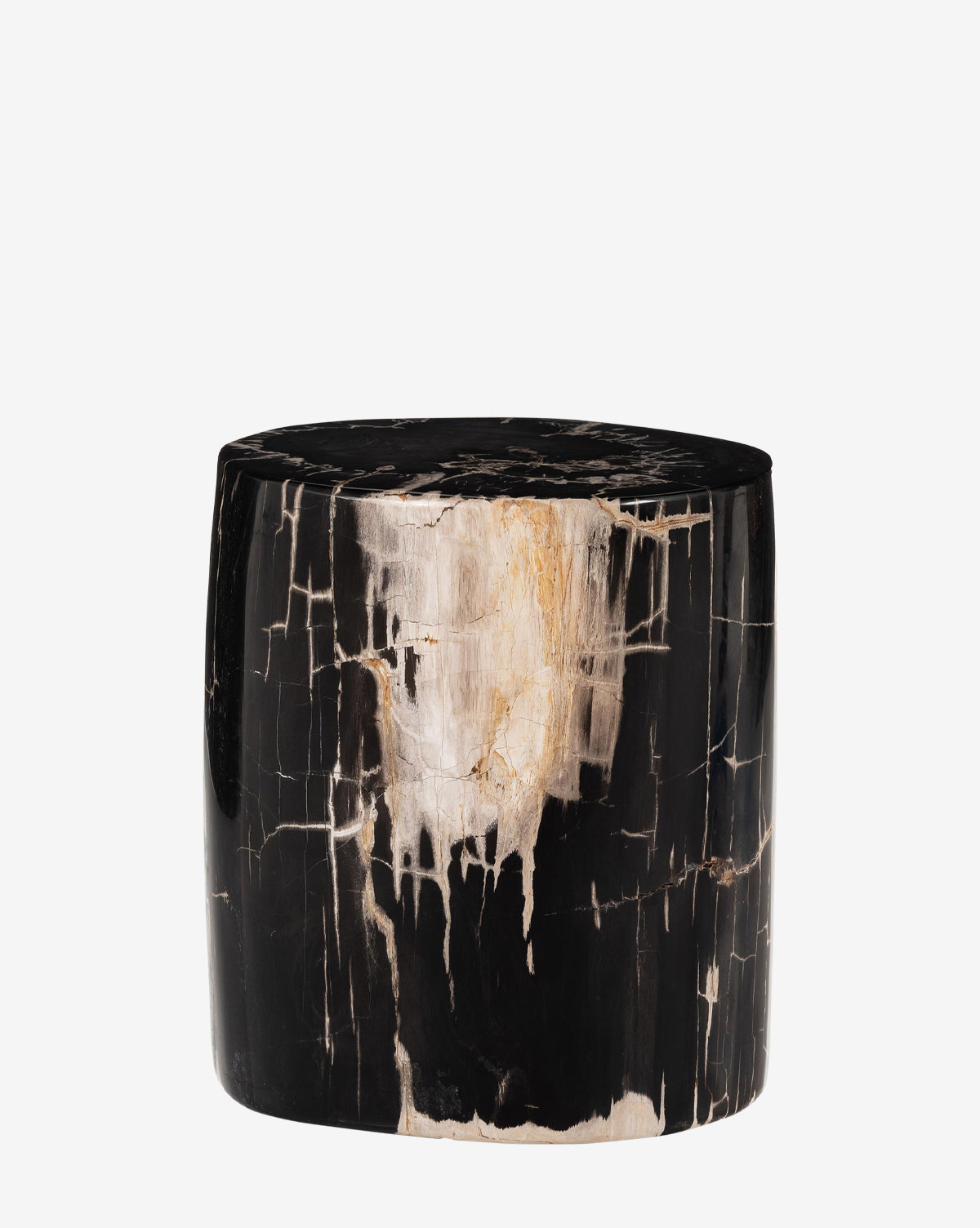 The Rune End Table is a cylindrical, hand-carved piece in black and beige polished petrified wood, showcasing natural cracks and unique patterns, by McGee & Co.