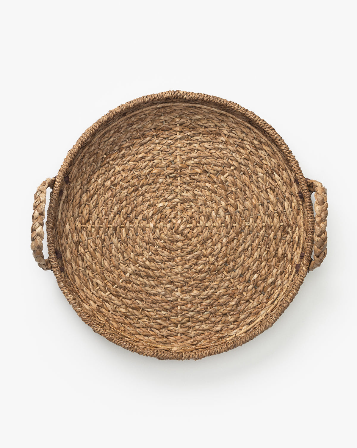 The Salter Woven Tray is a round wicker basket with two braided handles on opposite sides, displayed from a top-down view against a white background by McGee & Co.