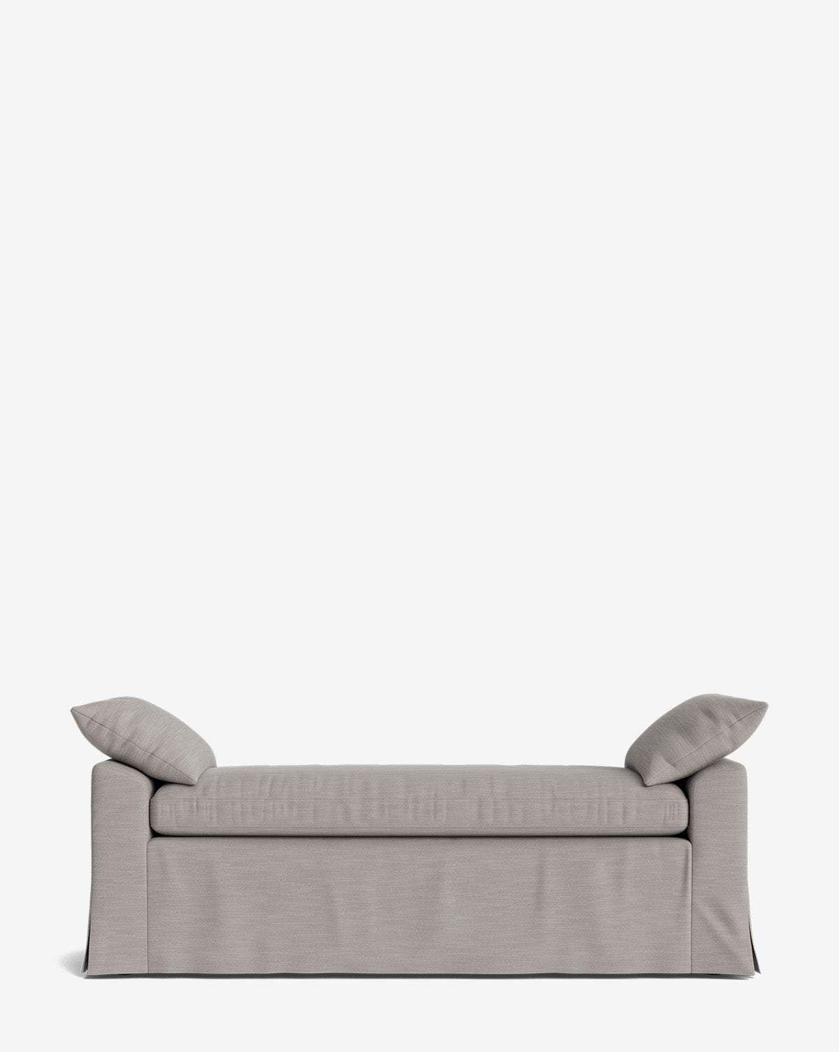 The Scaletta Bench, shown on a plain white background, is a modern light gray sofa with a skirted base and two matching cushions, crafted with performance fabrics for lasting style, by McGee & Co.