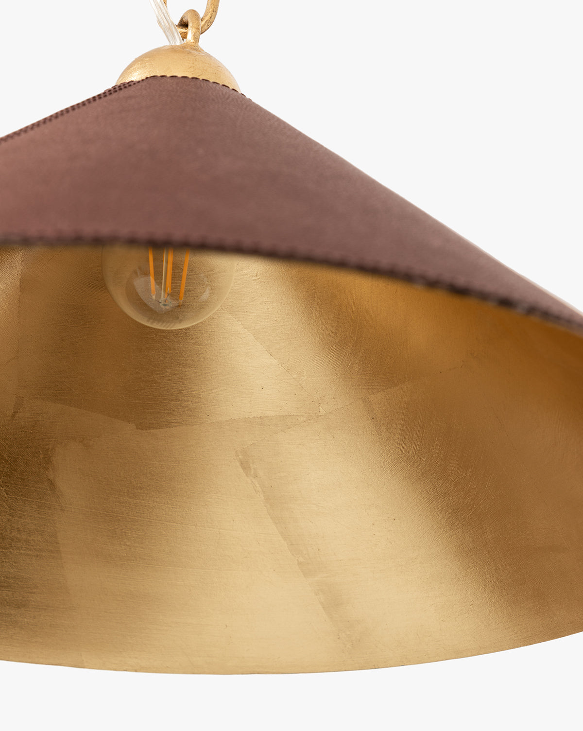 Close-up of the Scarlett Pendant, featuring a brown outer shade, gold leafed iron inner surface, and an exposed bulb for an elegant lighting accent, by McGee & Co.