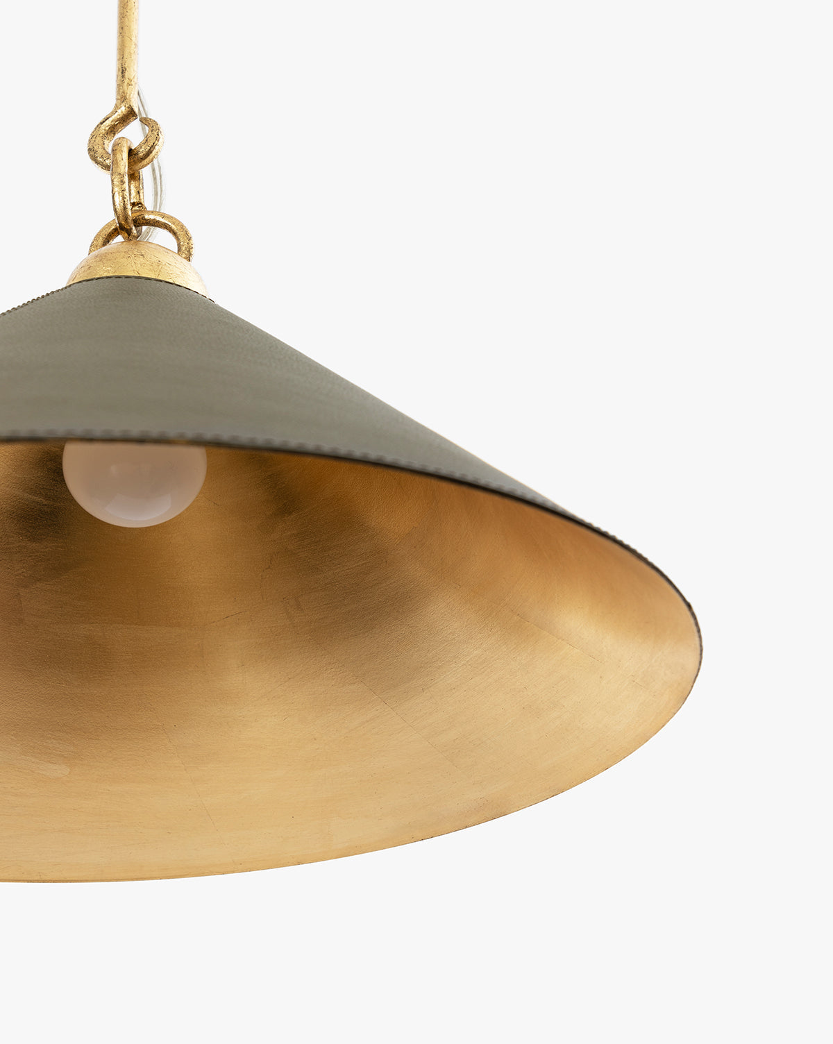 The Scarlett Pendant features a matte dark green exterior, a reflective gold leafed iron interior, and a visible white bulb, shown close-up against a white background by McGee & Co.