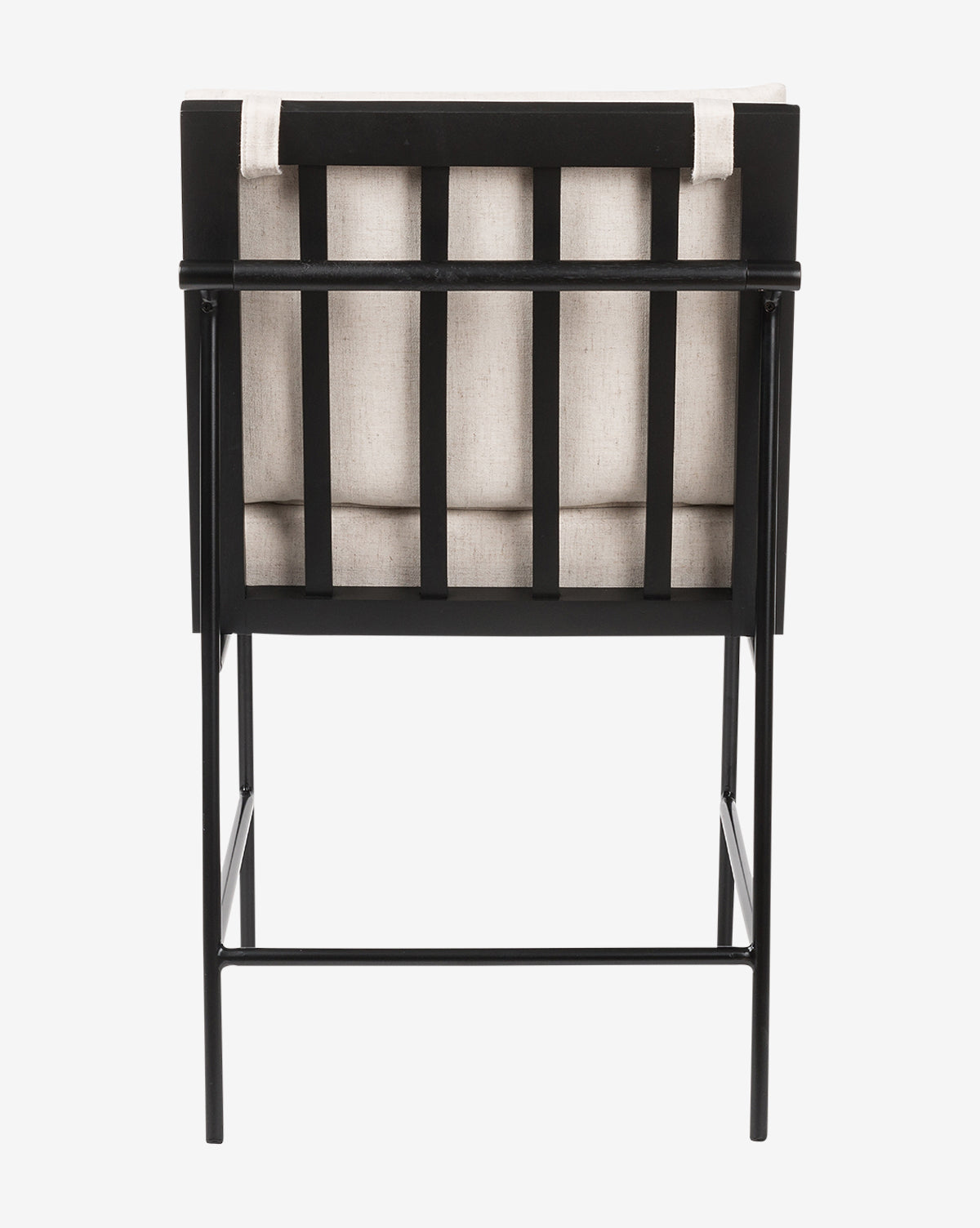 The Selas Dining Chair has a black iron frame with vertical slats and light beige cushioned backrest and seat in high-performance fabric, shown from the rear against a white background by McGee & Co.