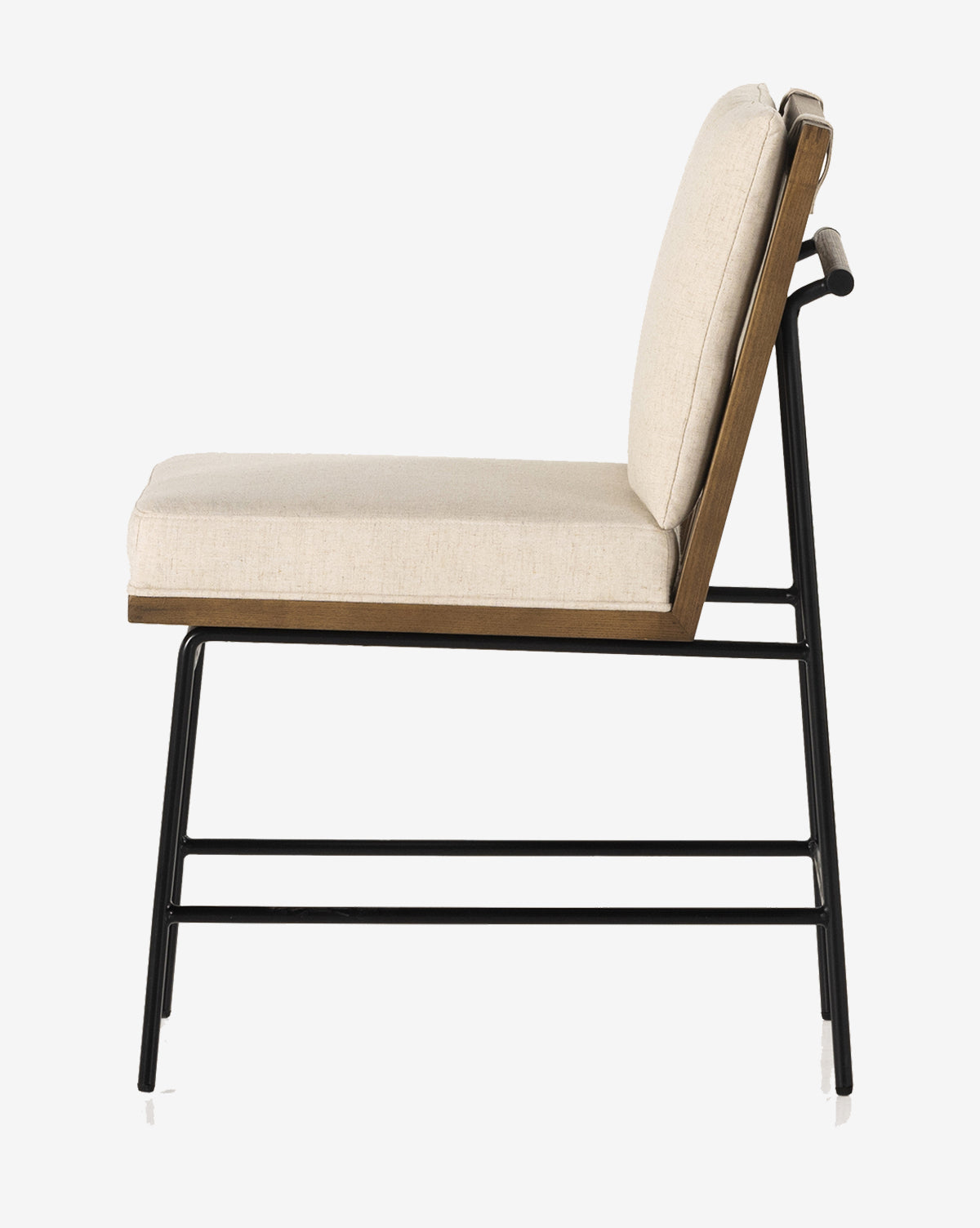 A side view of the Selas Dining Chair showcases its beige high-performance fabric seat and backrest, wooden frame, and black iron legs with white-tipped feet, by McGee & Co.
