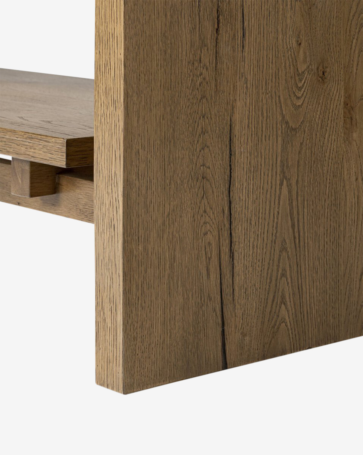 Close-up of the Selene Bookcase featuring a thick vertical panel and horizontal shelf, both crafted from light brown wood with natural grain patterns for a modern, organic look by McGee & Co.