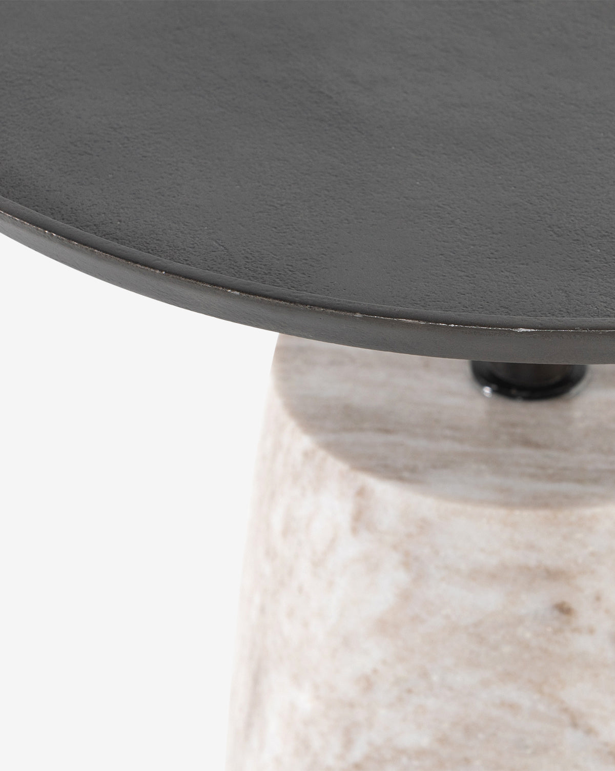 Close-up of the Four Hands Sheba Side Table, showcasing its round matte black top and textured light-colored cylindrical base, McGee & Co.
