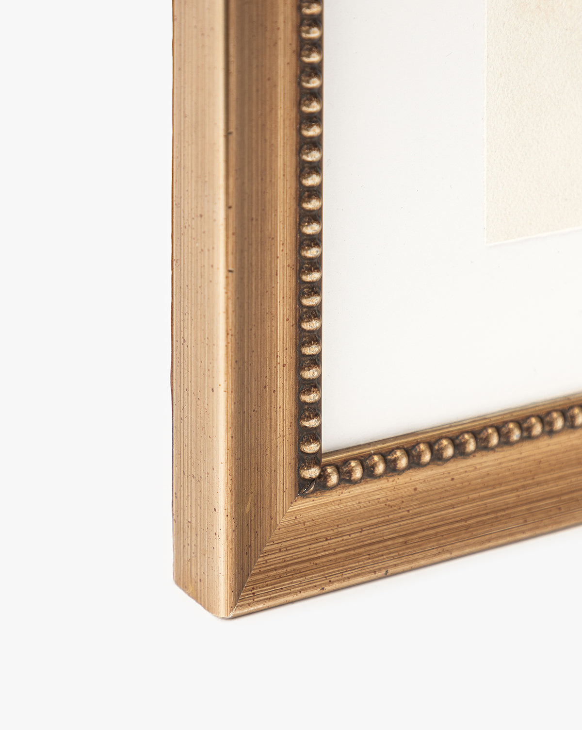 Close-up of the corner of a gold-colored, beaded picture frame with a white mat, showcasing Sky Studies 2 art print against a plain white background—ideal for displaying calming artwork.