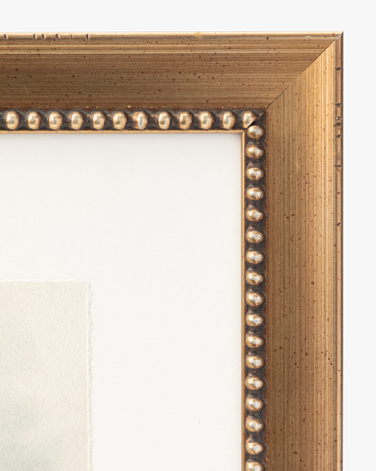 Close-up of the top right corner of a gold beaded frame holding Sky Studies 4, a giclee print with a white mat—perfect for elevating your gallery wall art.