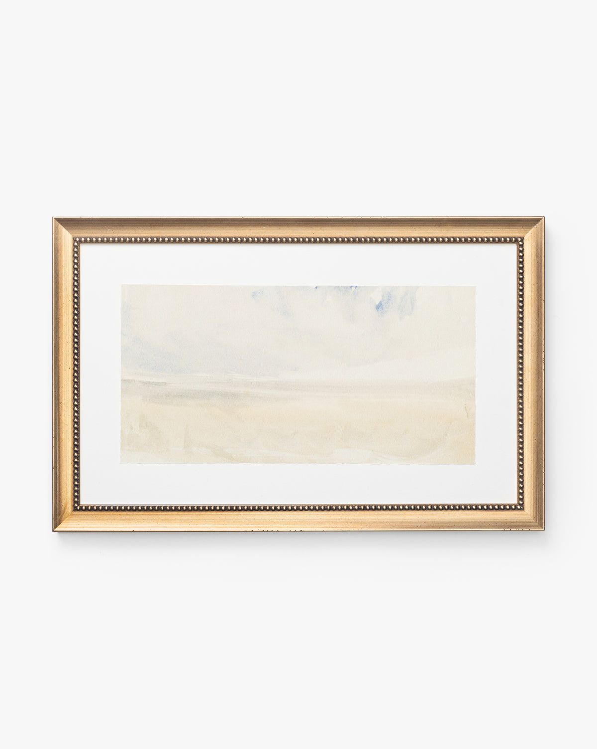 Sky Studies 5 is a minimalist watercolor landscape in soft beige and light blue, presented in an antique silver wood frame with elegant beaded detailing for a calming look.