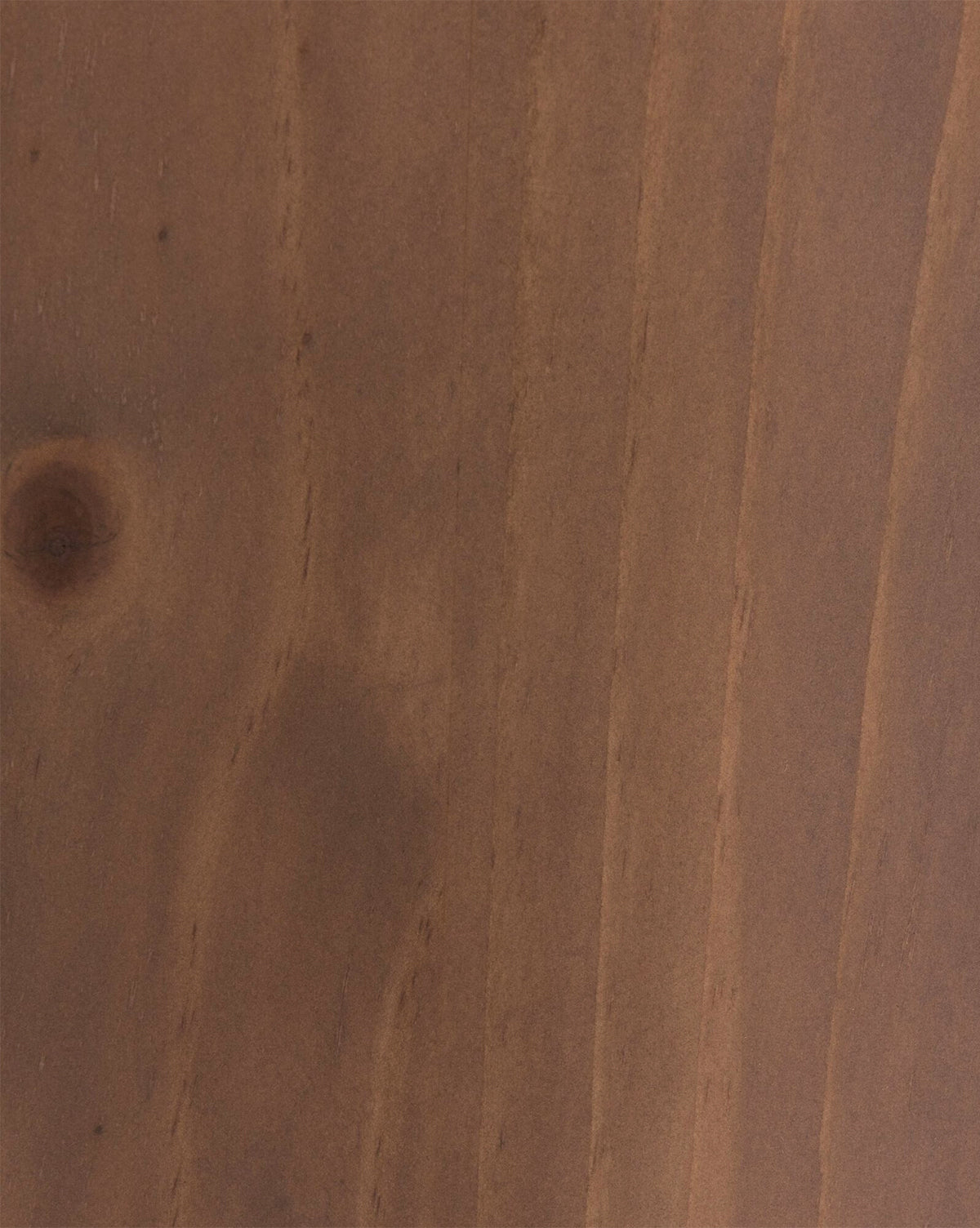 A close-up of the Sloane Sideboard’s smooth, warm brown wooden surface reveals distinct grain patterns and a small knot on the left—ideal for adding character to your European midcentury décor, by McGee & Co.