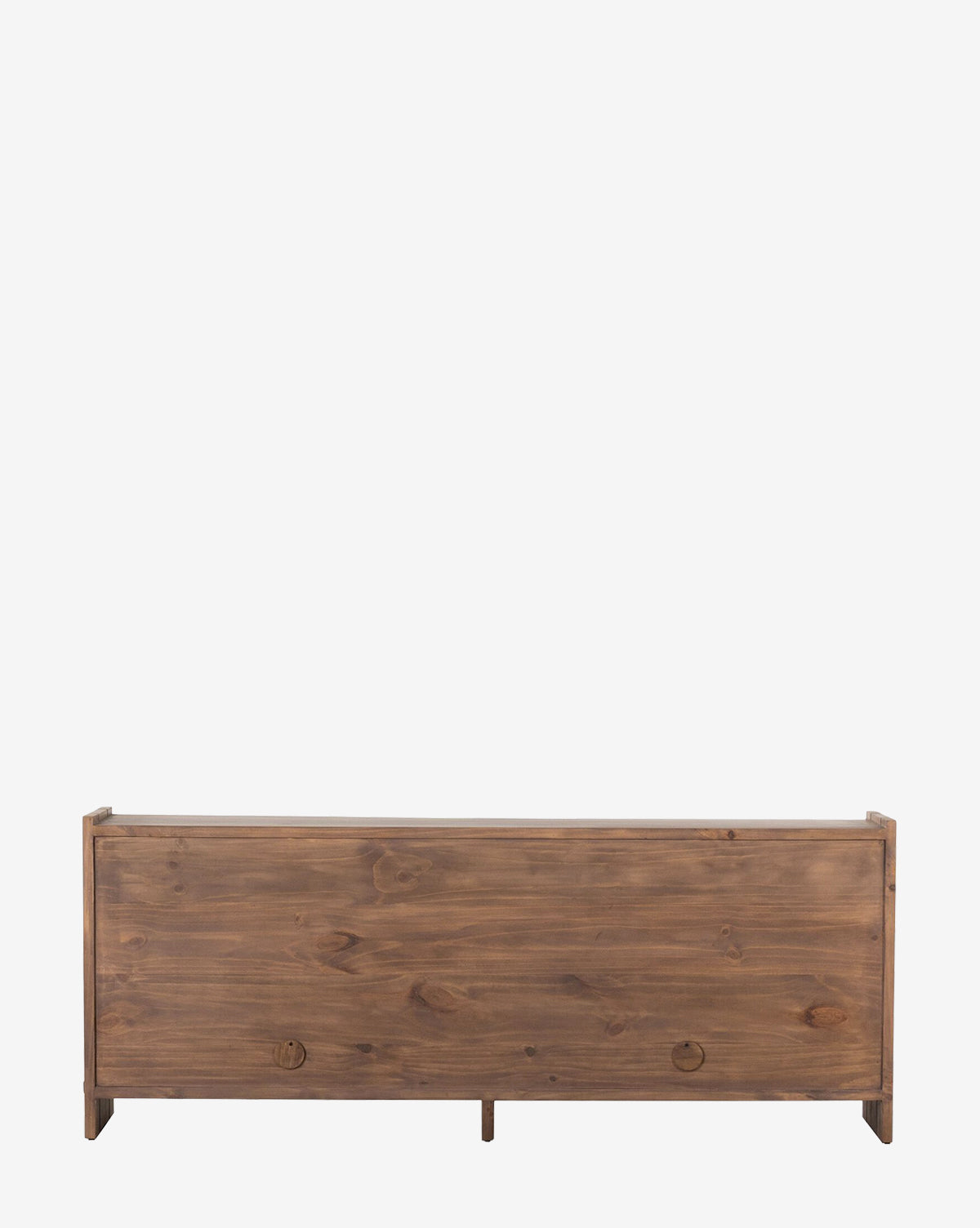 The Sloane Sideboard is a wooden storage bench with a rectangular shape, smooth front panel showcasing visible wood grain, and two round cut-out handles, reflecting the clean lines of European midcentury design against a plain white background, by McGee & Co.