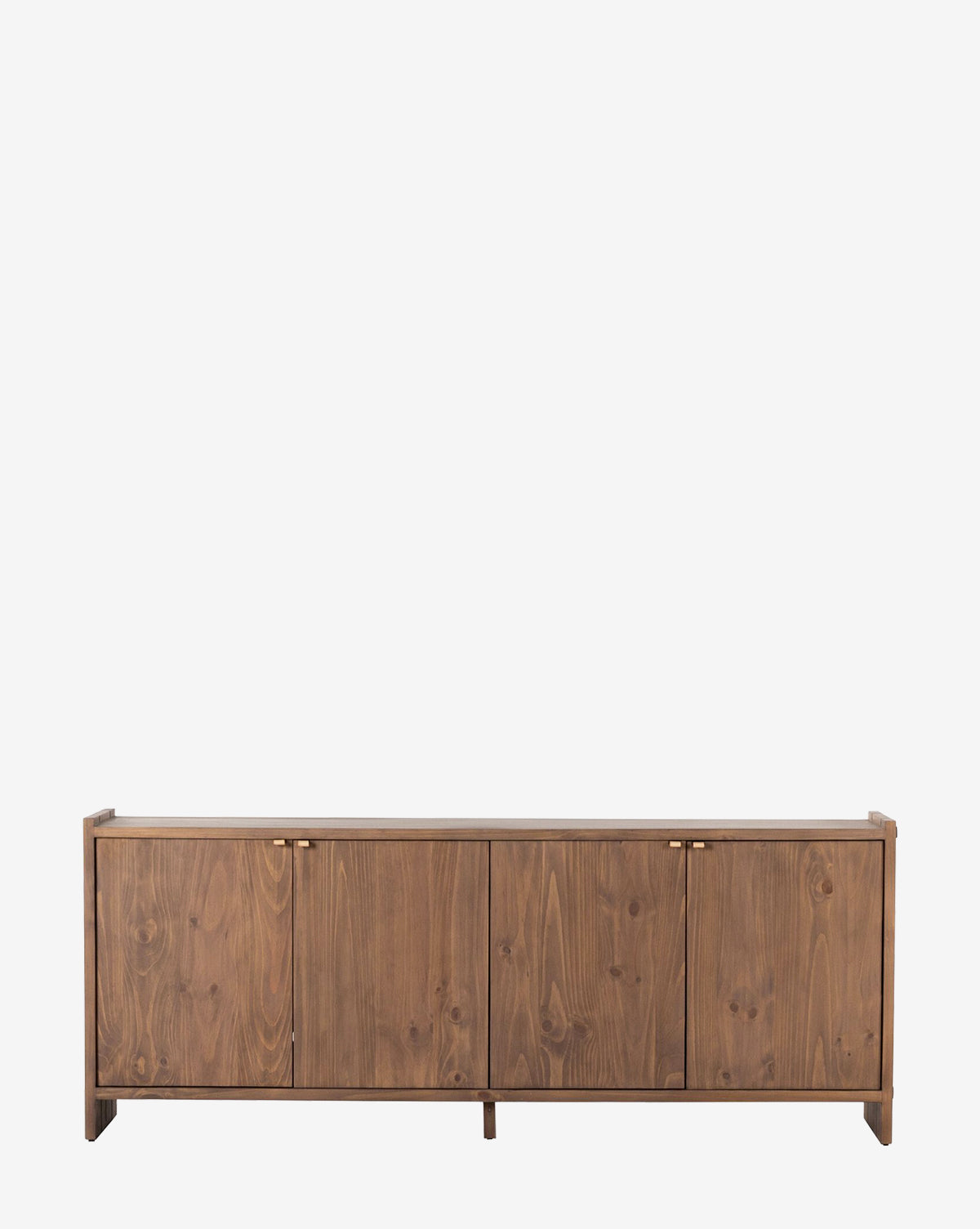 The Sloane Sideboard is a low, modern European midcentury piece with four cabinet doors, a natural wood finish, and simple brass handles, shown against a plain white background by McGee & Co.