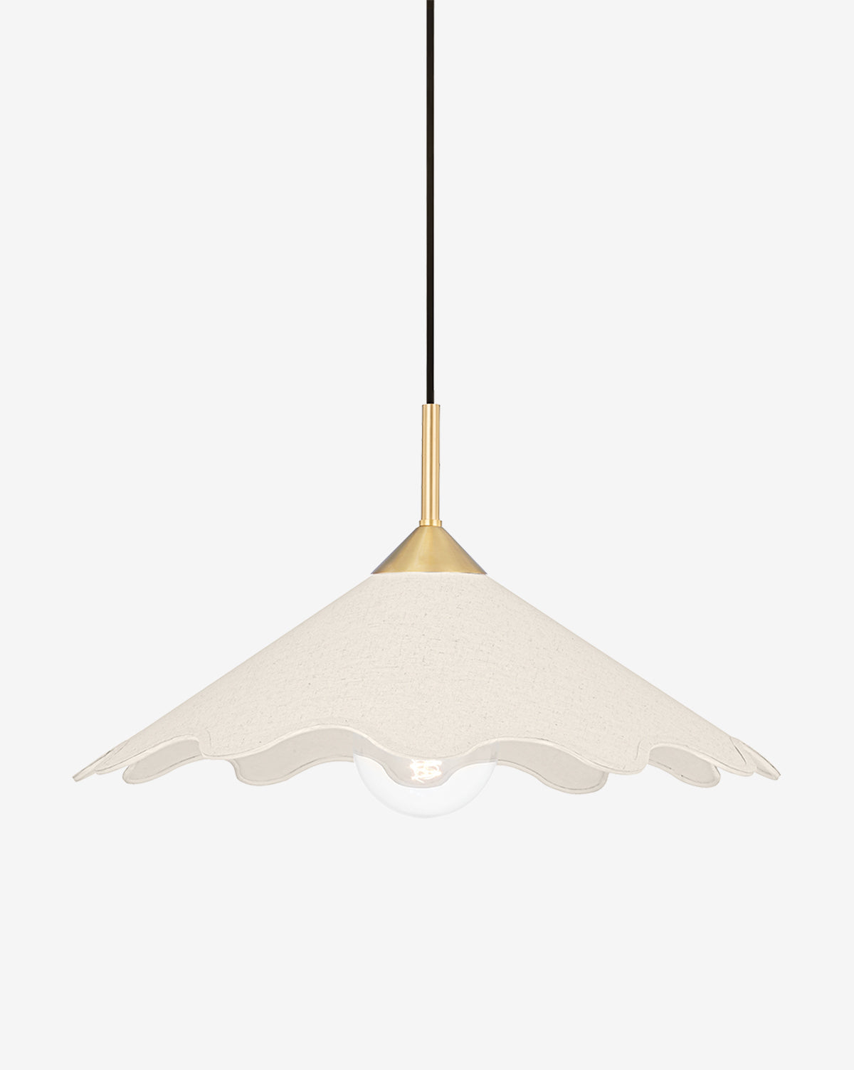 The Sodsai Pendant features a wavy, scalloped off-white linen shade, a visible round bulb, and an aged brass accent joining the shade to its black cord, shown against a plain white background by McGee & Co.