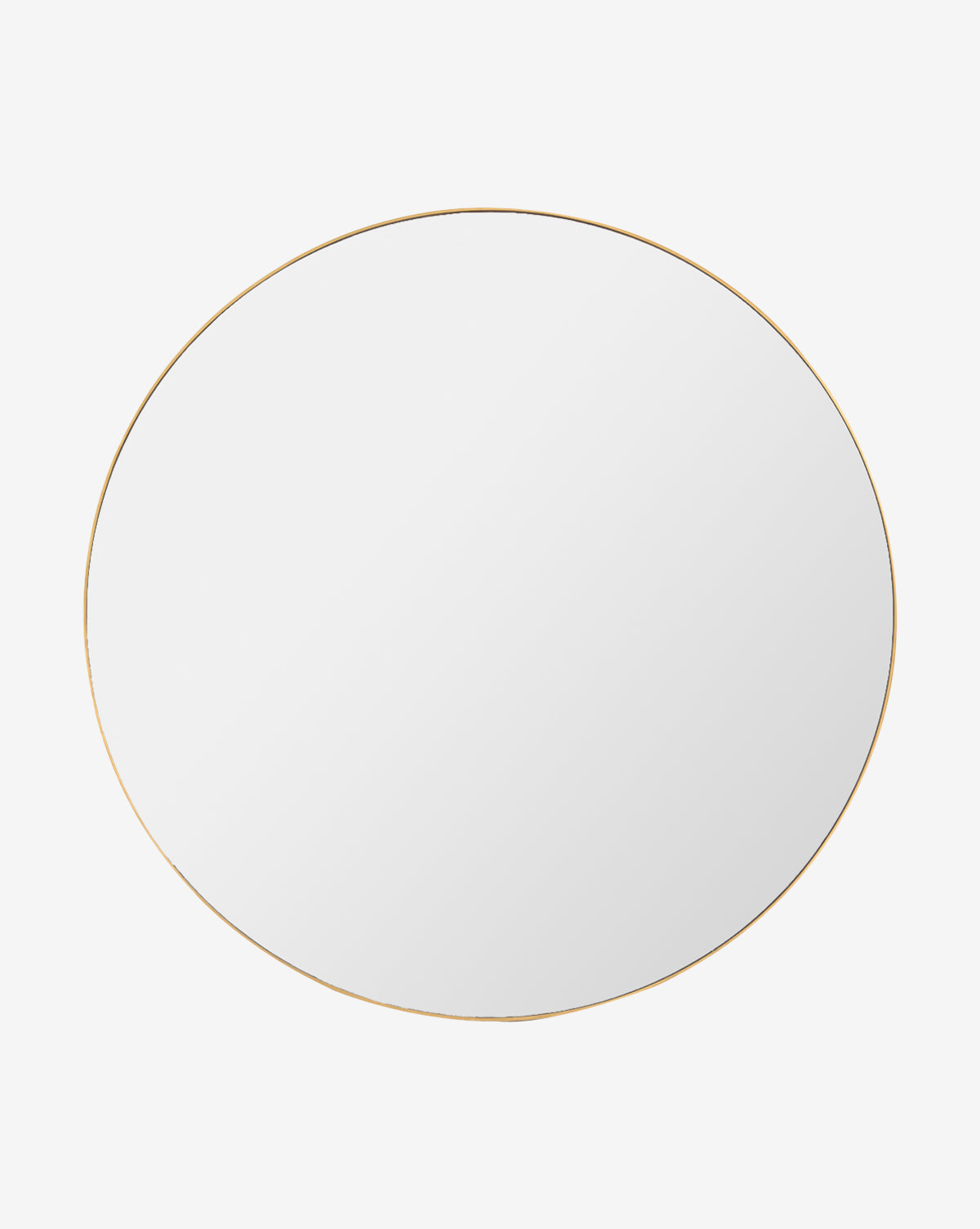 The Solange Mirror is a round minimalist mirror featuring a thin stainless steel frame in a gold finish, shown against a plain white background, by McGee & Co.