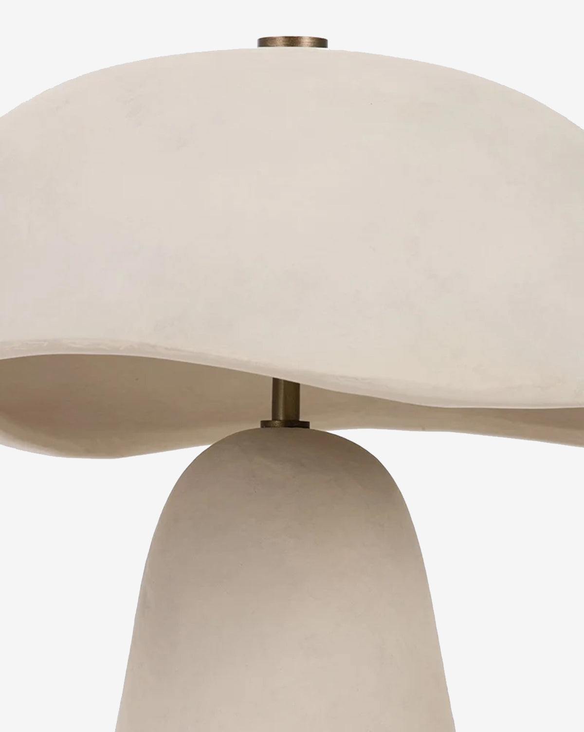 A close-up of the Soloma Table Lamp showcases its smooth, off-white mushroom-shaped ceramic shade and base in artisan white, joined by a metallic rod for a modern look, by McGee & Co.