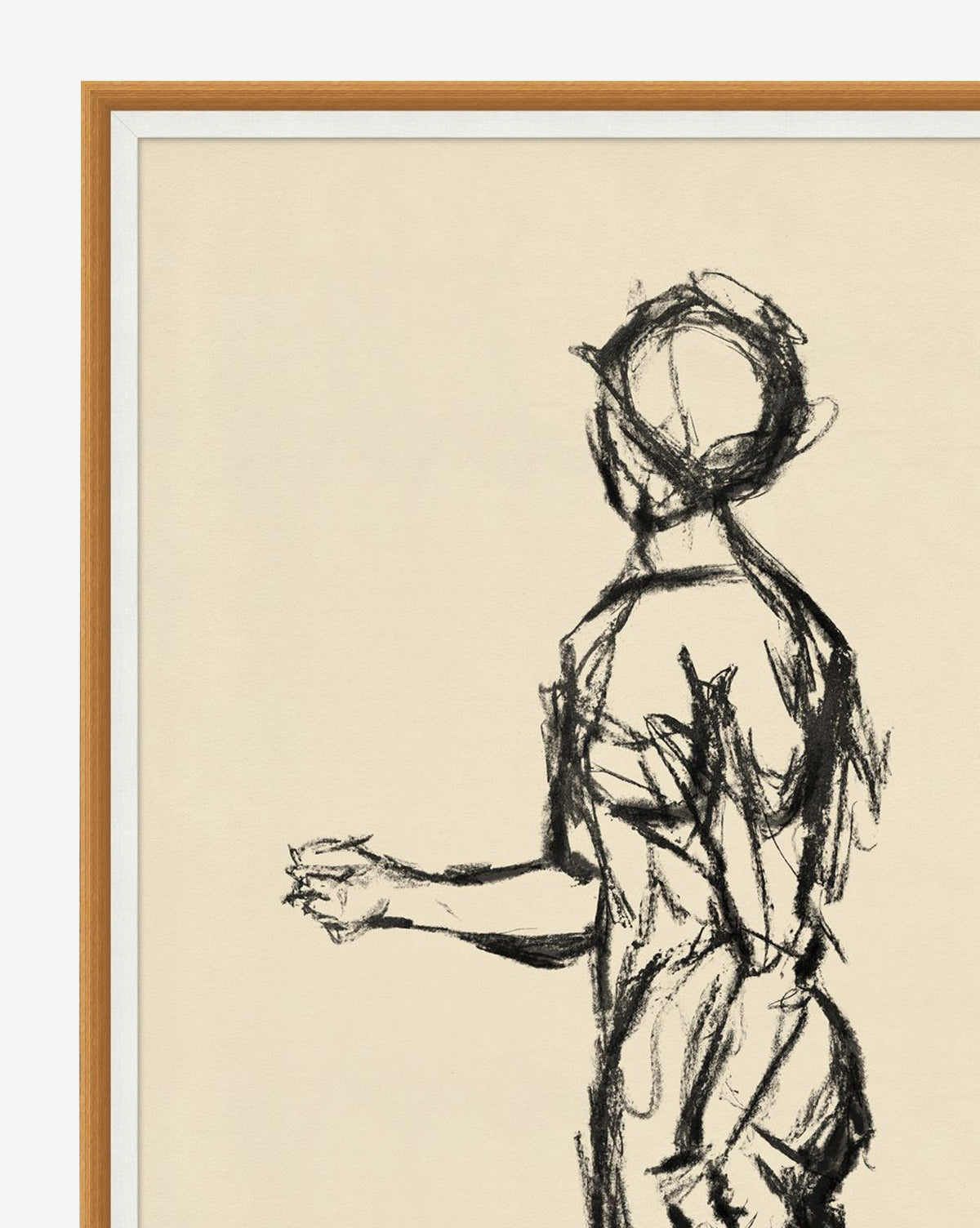 Soulful Silhouette is a gallery-quality charcoal sketch of a standing human figure in profile, facing left. Expressive lines energize the piece, which is elegantly framed in light wood on a cream background, by McGee & Co.
