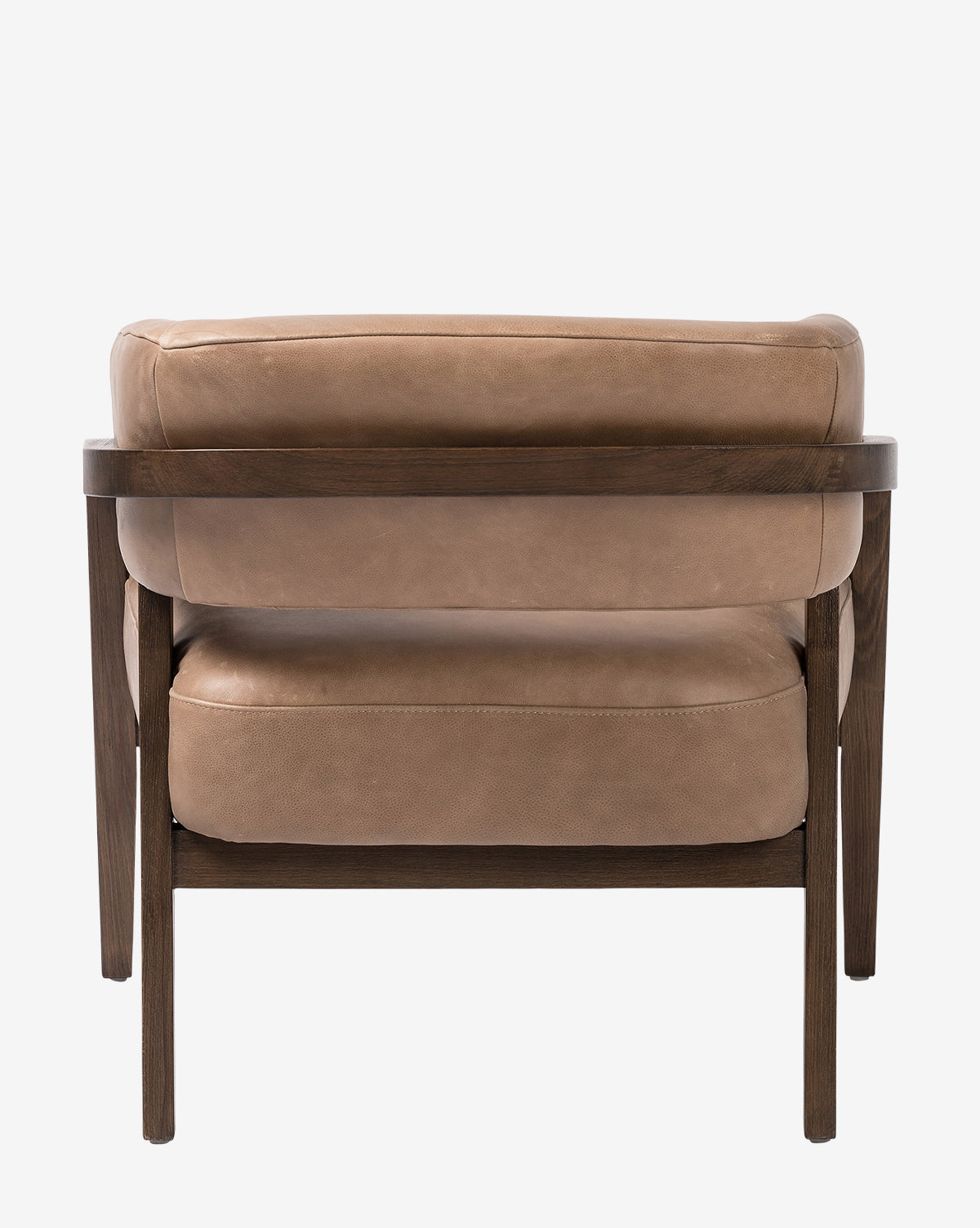The Stanley Lounge Chair features tan leather upholstery and a dark wood frame, highlighting its modern design when viewed from the back against a white background, by McGee & Co.