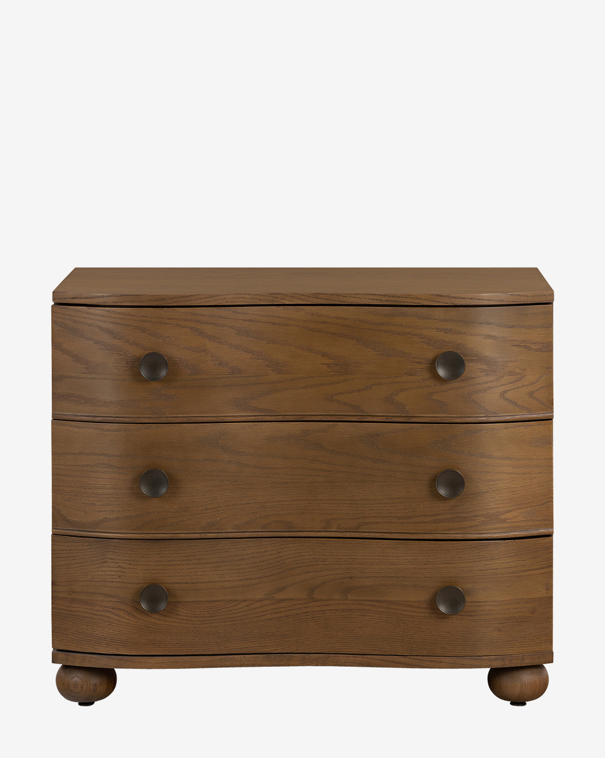The Strasburg Nightstand is a wooden three-drawer dresser with round black metal knobs, rounded feet, and a natural wood grain finish—ideal for bedroom styling or as an antique nightstand, by McGee & Co.