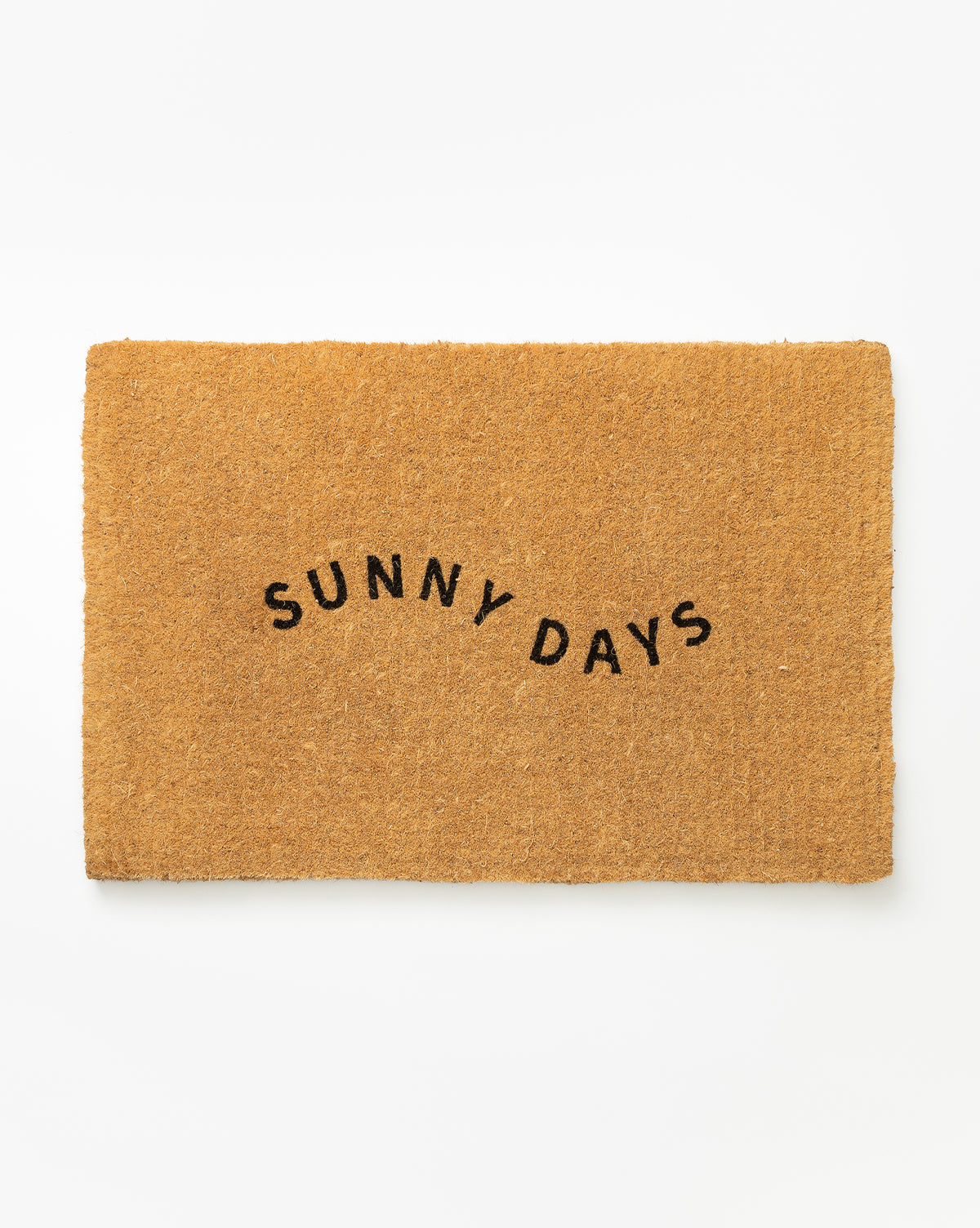 The Sunny Days Doormat is a rectangular brown mat with arched black lettering at the center, perfect for brightening your entryway, by McGee & Co. Ideal for outdoor use, its shown here on a plain white background.