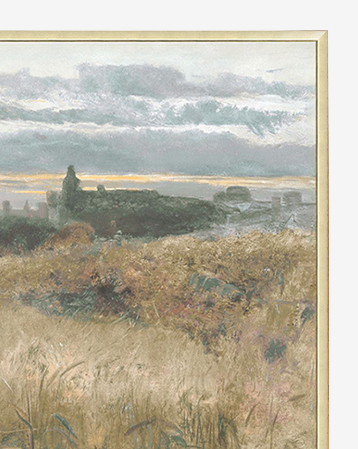 Sunset Fields, a giclee print on canvas, captures a tranquil grassy field with wild plants, distant building silhouettes, and a cloudy sky—all elegantly showcased in a silver wood frame.