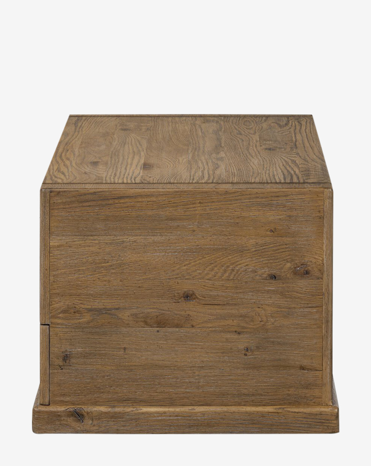 The Sutton Trunk is a square wooden storage box featuring a simple, rustic weathered oak finish with visible wood grain on all sides, shown against a plain white background by McGee & Co.
