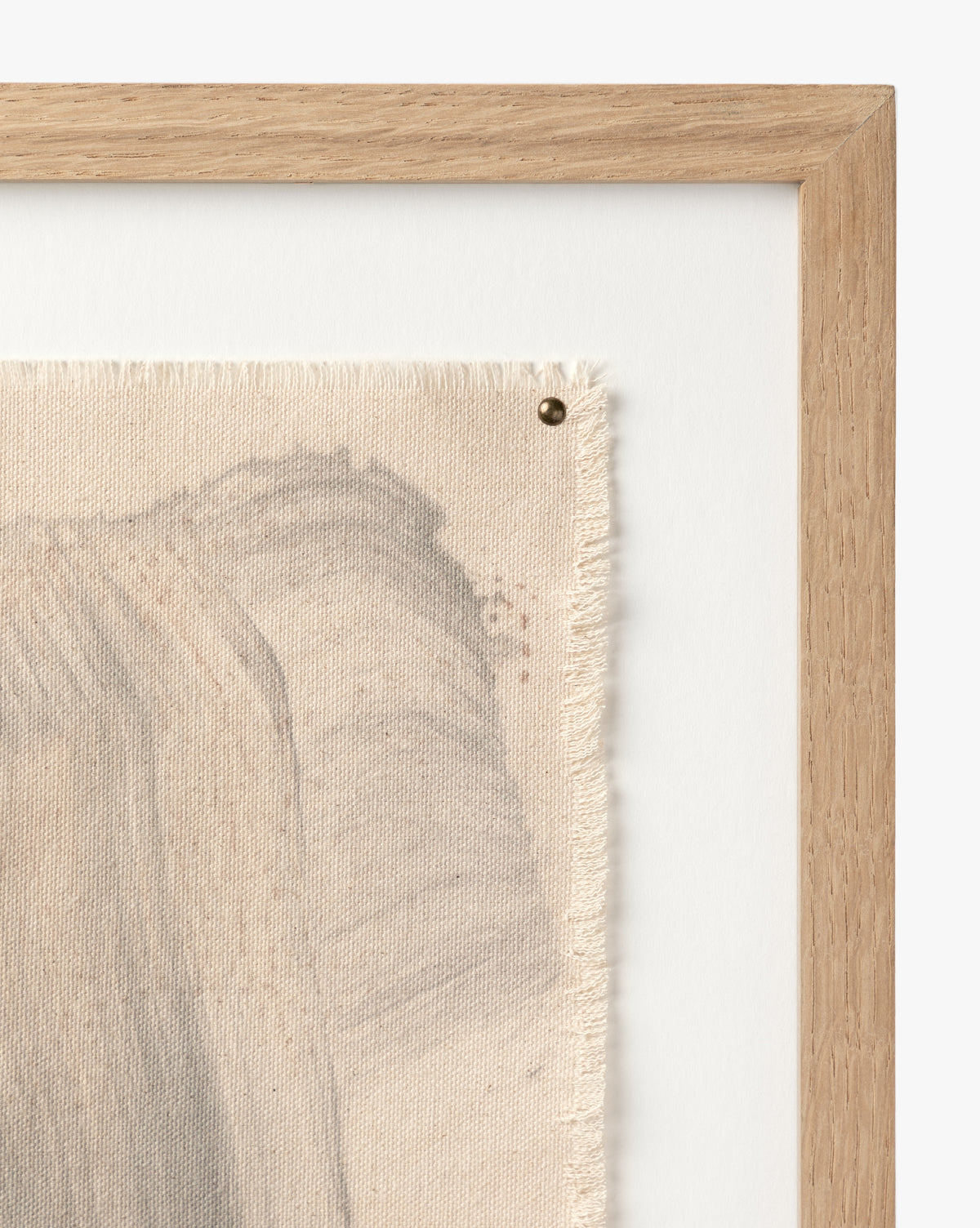 Close-up of Swath 2 Sepia: a textured canvas with abstract gray brushstrokes and frayed edges, pinned to a white background and elegantly framed in white oak.