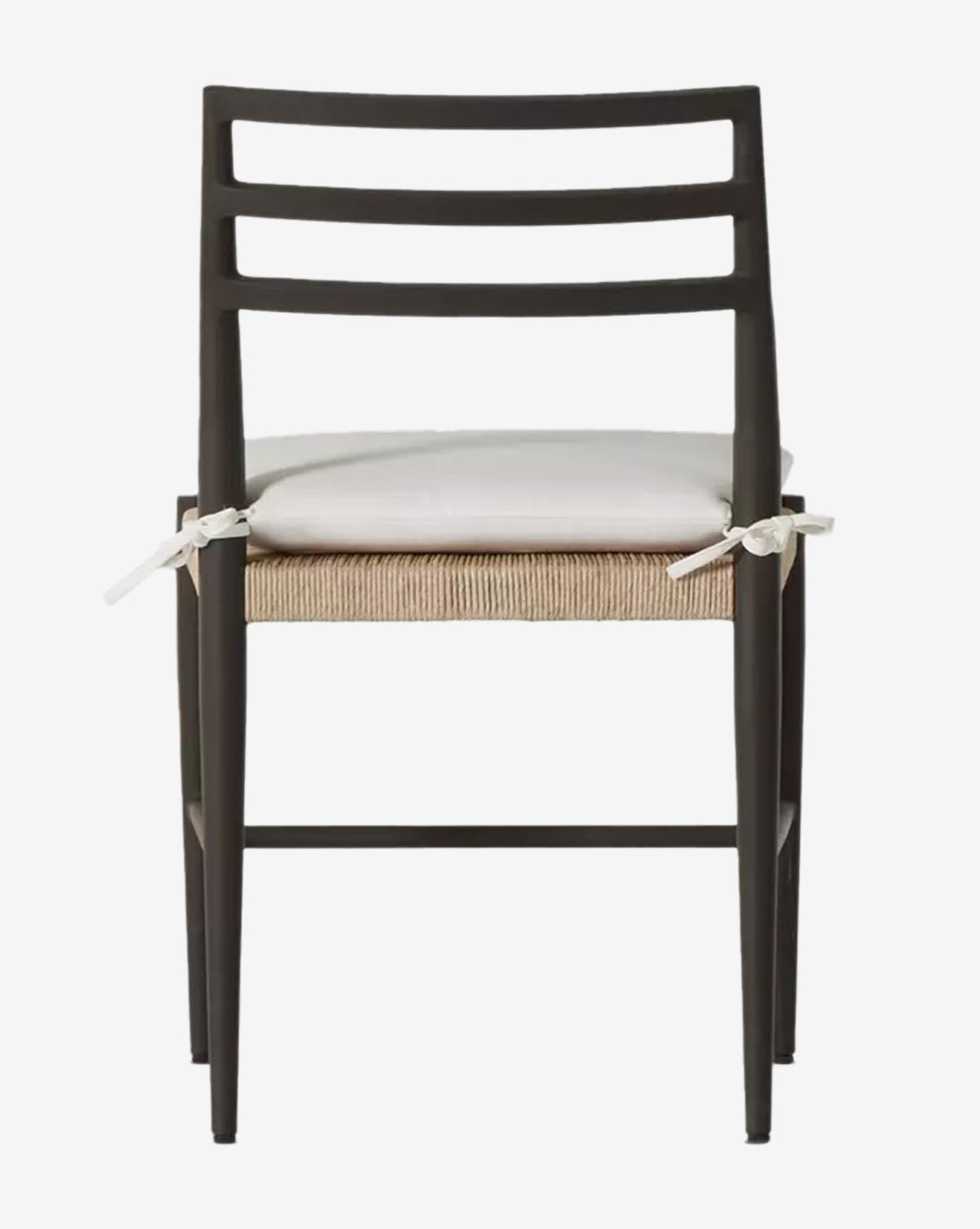 The Tabitha Outdoor Dining Chair showcases a dark aluminum frame, ladder-style backrest, woven seat, and a white removable cushion with fabric straps. Photographed from the front, it stands out against a white background by McGee & Co.