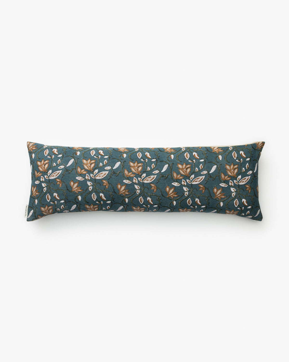 The Teal Lotus Floral Pillow Cover features a long rectangular design with a dark teal background and a pattern of yellow and white flowers with green leaves, shown on a plain white surface by McGee & Co.
