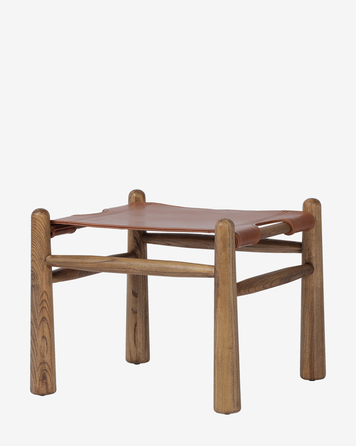 The Tierney Ottoman by Four Hands boasts a minimalist design with rounded solid wood legs and a seat of smooth, top-grain brown leather, offering modern simplicity and timeless elegance by McGee & Co.