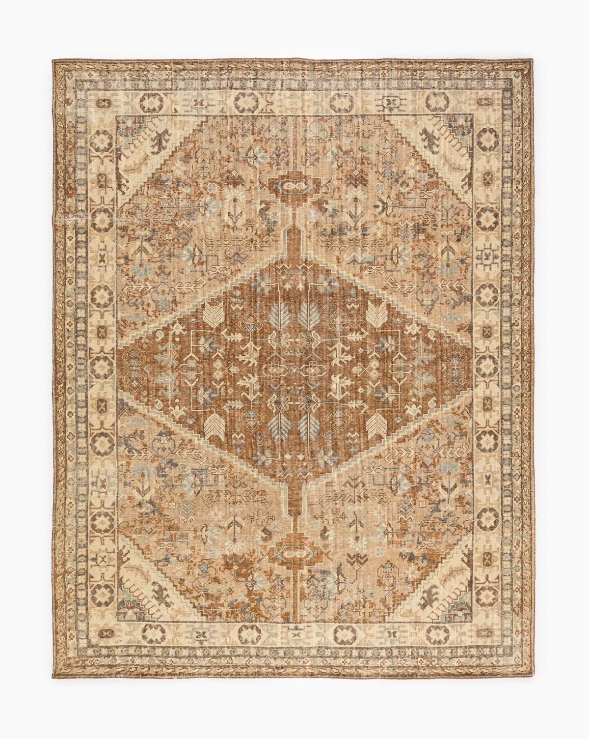 The Tulie Hand-Knotted Wool Rug showcases an intricate geometric and floral design in muted earth tones, including browns, creams, and beiges, with a central medallion and elegant decorative border, by McGee & Co.