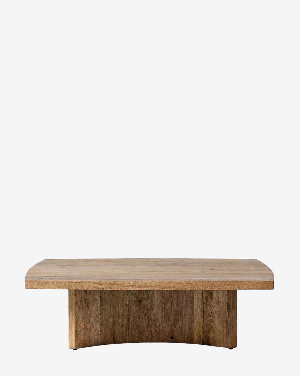 The Uma Coffee Table is a contemporary rectangular oak piece featuring a thick top and a curved, solid base, shown against a plain white background by McGee & Co.