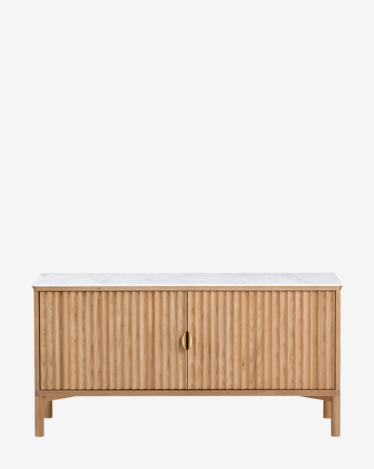 The Vale Sideboard features vertical-grooved oak doors, a white marble top, and two central antique brass handles, shown against a plain white background by McGee & Co.