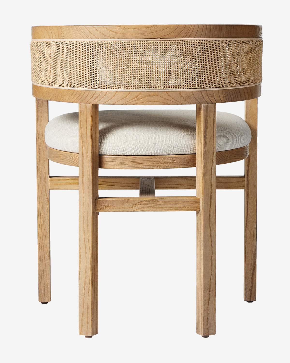 The Valissa Dining Armchair features a modern wooden frame, round cane seatback, and light beige cushioned seat—an elegant choice for contemporary spaces, shown from the back by McGee & Co.