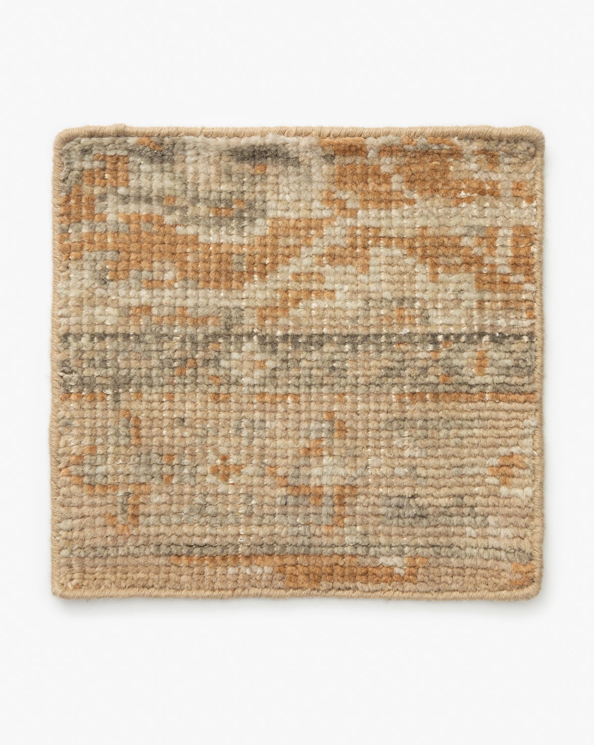 The Vanderwood Hand-Knotted Wool Rug Swatch is a square, wool rug with a textured surface in beige, tan, and light brown tones. It features an abstract mottled pattern that nods to traditional textiles on a plain white background by McGee & Co.