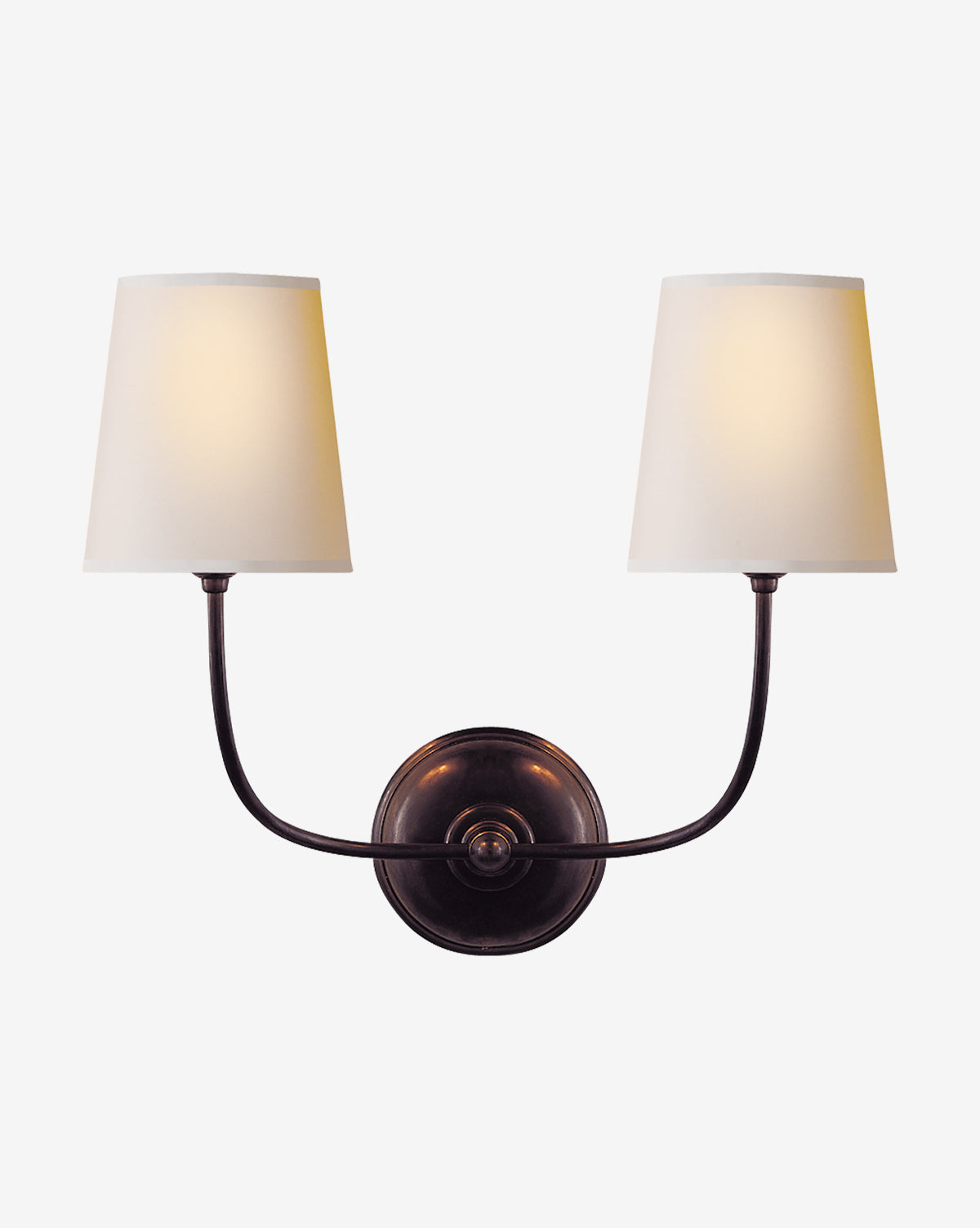 Certainly! Here is your sentence with the exact string McGee & Co. blended at the end: The Vendome Double Sconce by Visual Comfort & Co. Signature features two curved arms with white linen shades and candelabra bulbs, set on a dark metal base that contrasts beautifully against a white backdrop, McGee & Co.