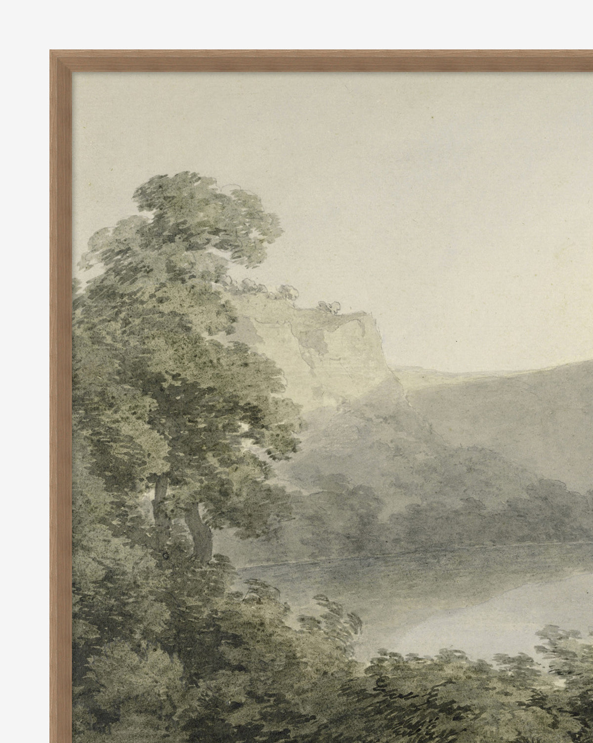 The Verde Landscape framed giclee print features a watercolor scene with a tree in the foreground, rolling hills, and a distant cliff beneath a pale, softly colored sky.