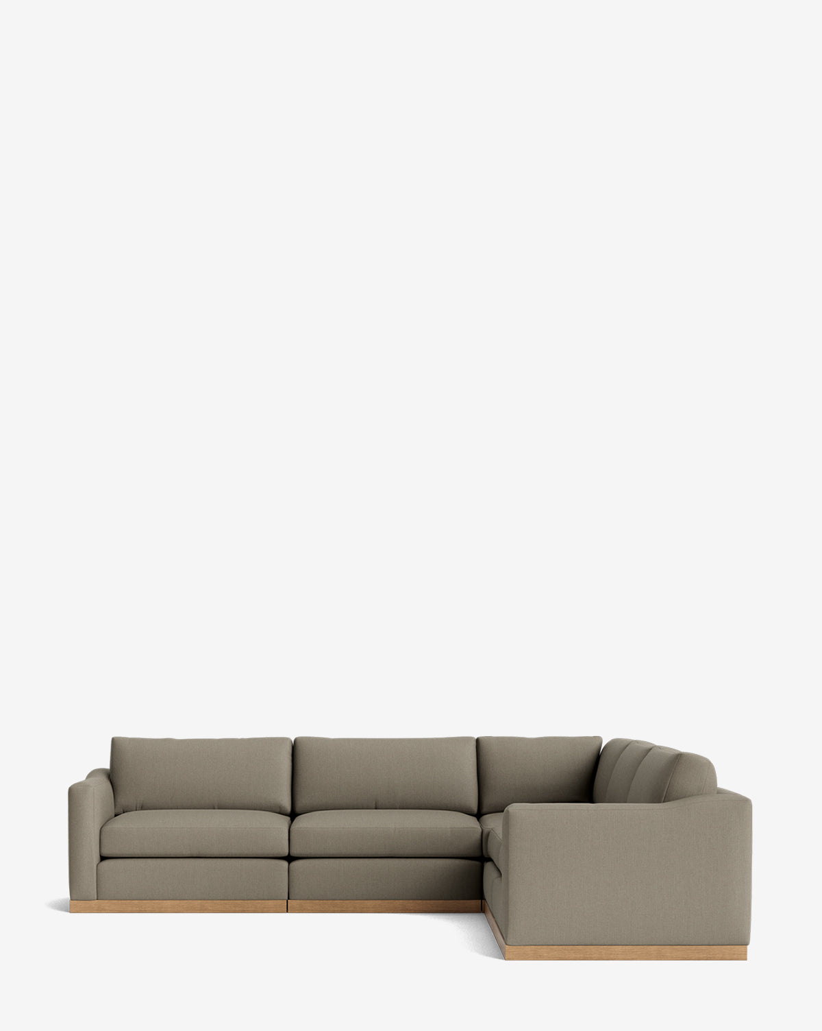 The Vernon Modular L Sectional 117.5 features muted olive green velvet upholstery and a low wooden base, shown against a plain white background, by McGee & Co.