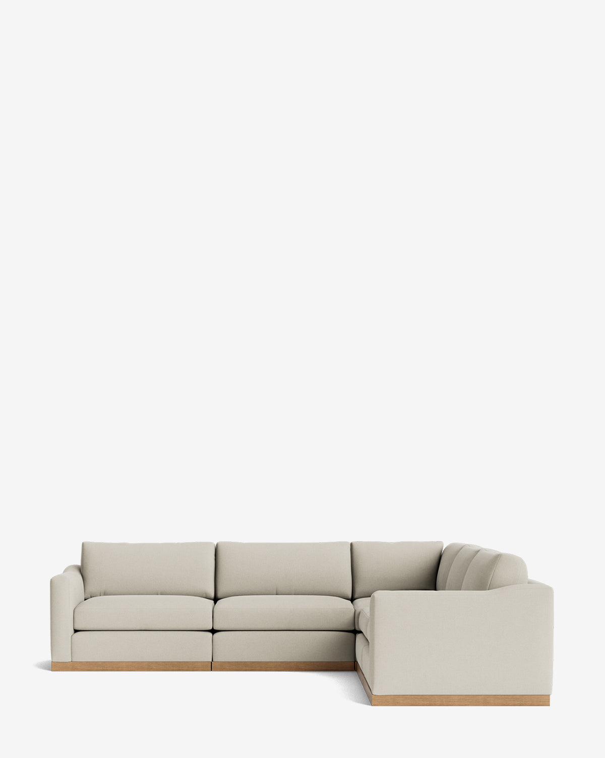 The Vernon Modular L Sectional 117.5 is a modern, light beige sofa with a wooden base, clean lines, and plush cushions, showcased against a white background by McGee & Co.