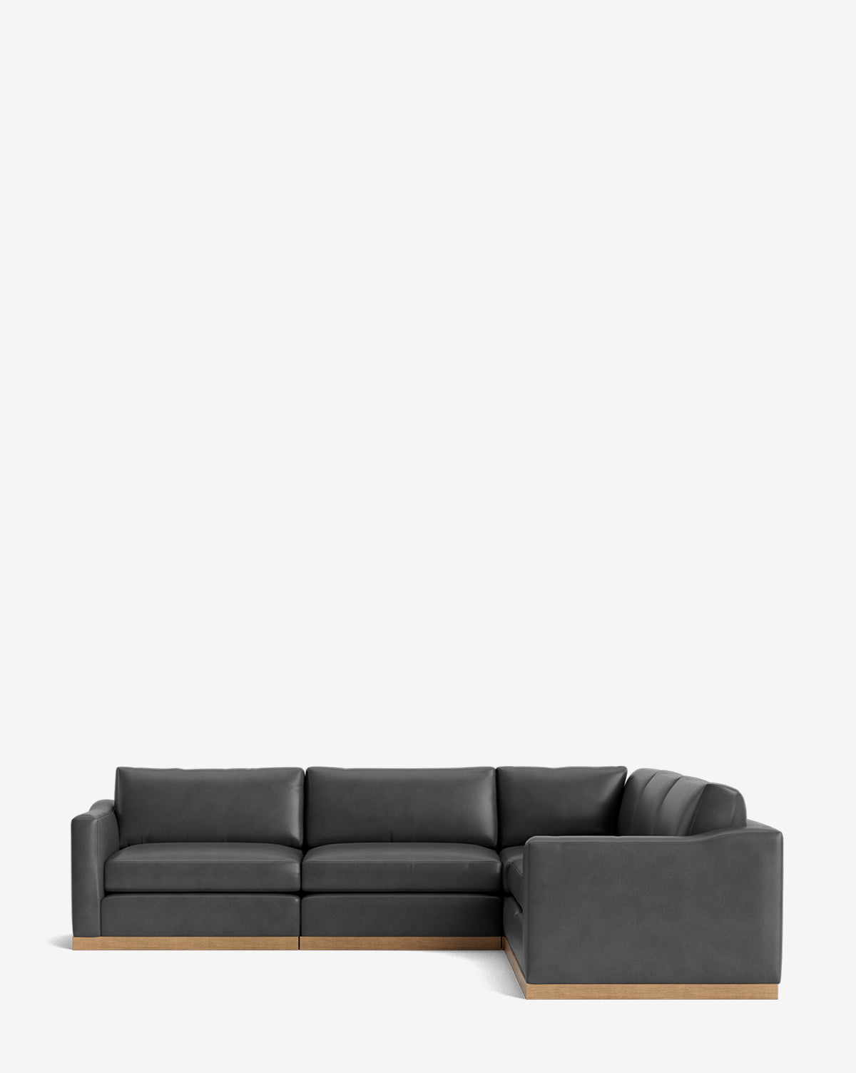 The Vernon Modular L Sectional 117.5 features clean lines, dark gray leather upholstery, and a wooden base, shown against a plain white background by McGee & Co.