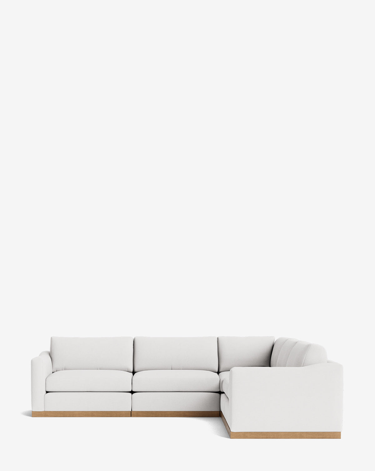 The Vernon Modular L Sectional 117.5 features light beige upholstery and a wooden base, set against a white background. This customizable sofa blends style and comfort, perfect for modern living spaces by McGee & Co.