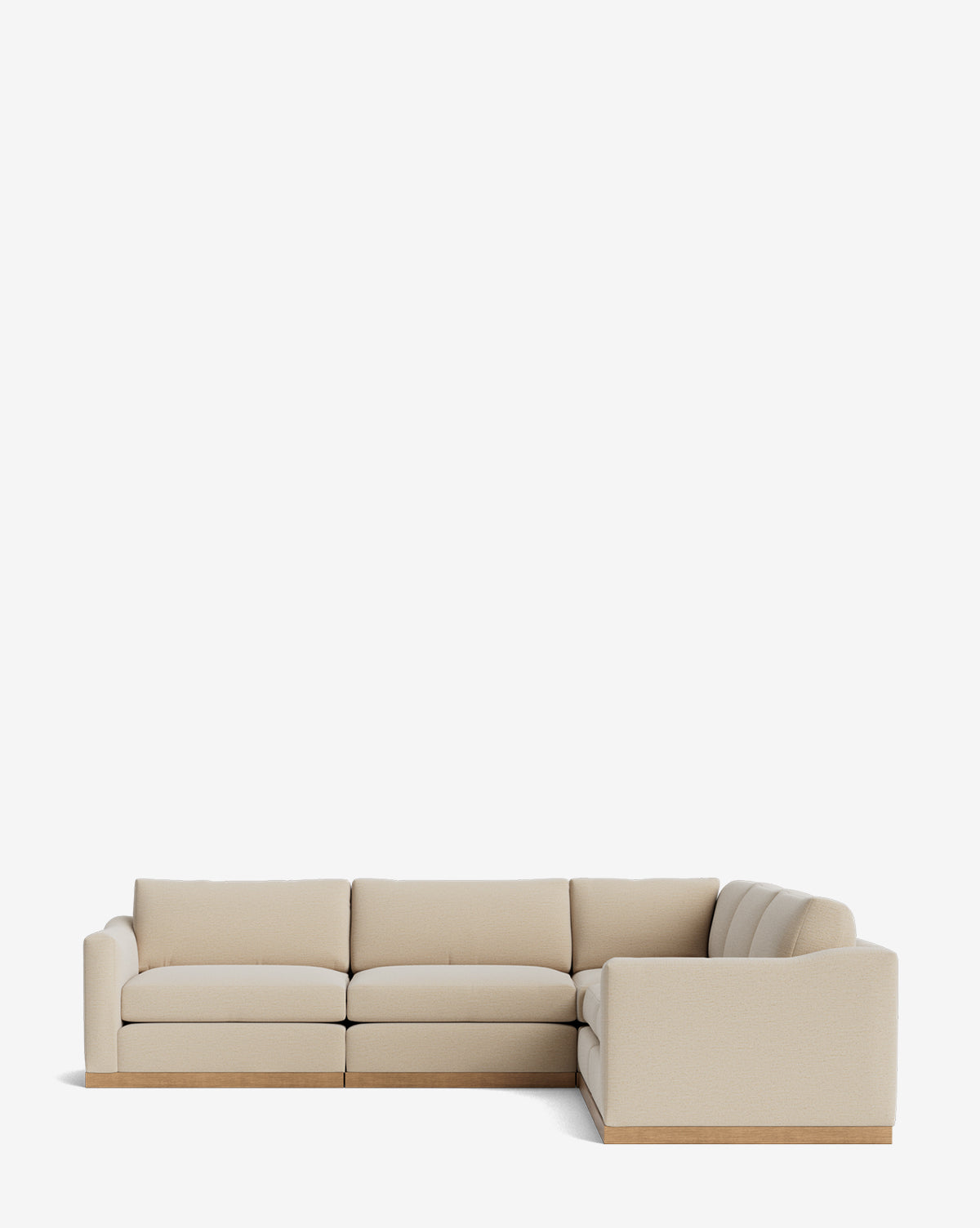 The Vernon Modular L Sectional 117.5 is a modern beige sofa featuring plush cushions and a wooden base, displayed against a plain white background by McGee & Co.