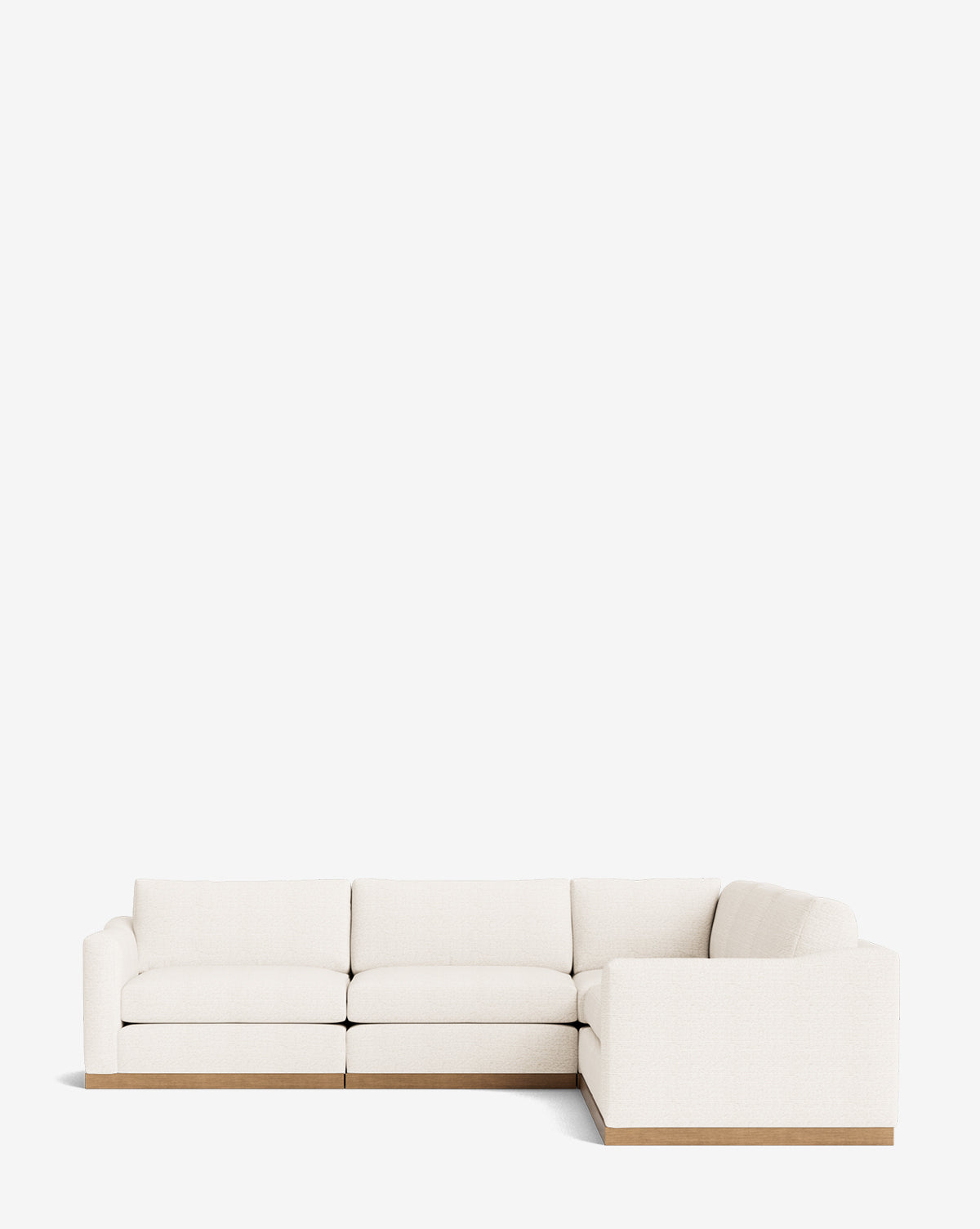 The Vernon Modular L Sectional 117.5 features off-white upholstery and a light wooden base in a modern L-shaped design, shown against a plain white background, by McGee & Co.