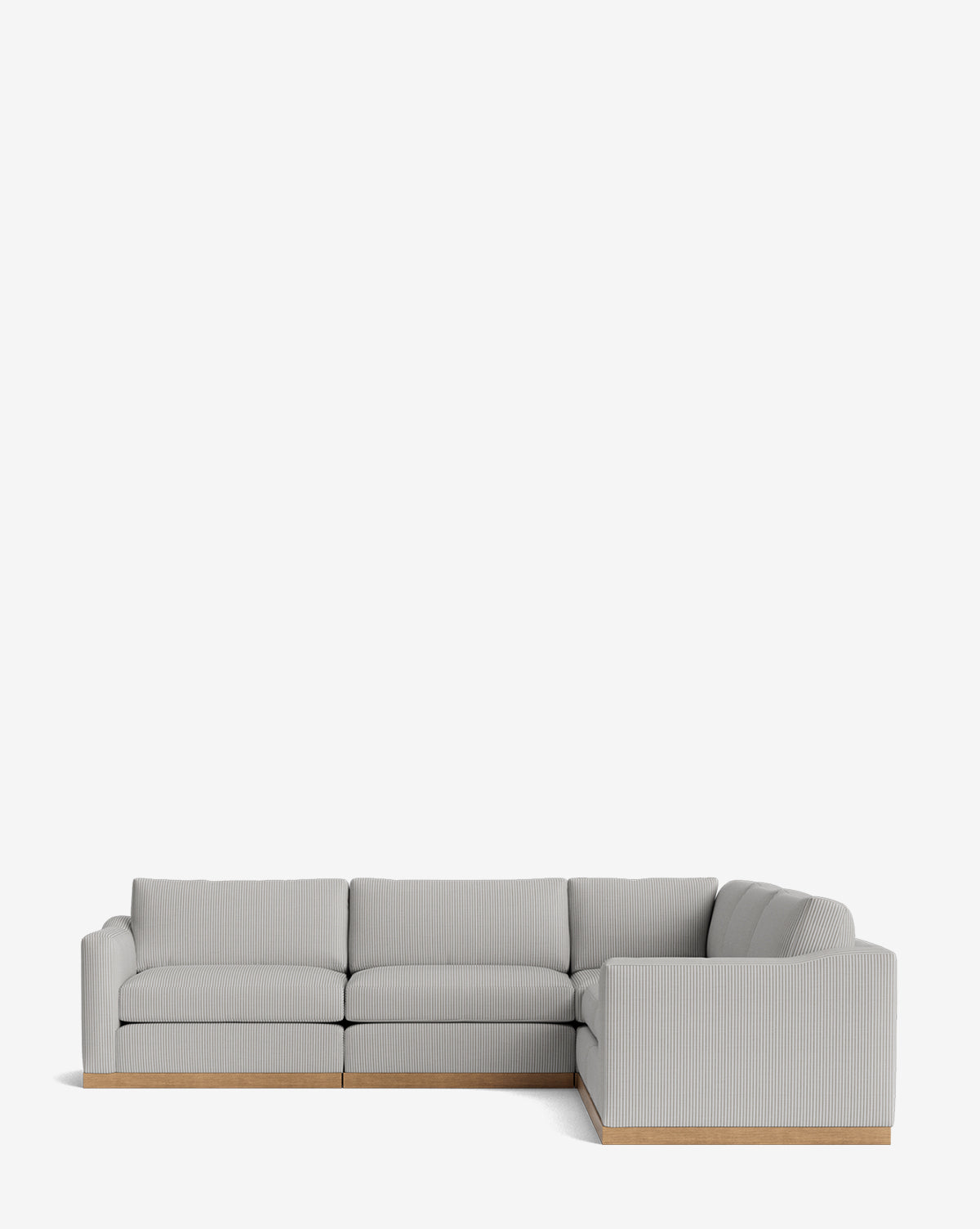 The Vernon Modular L Sectional 117.5 features a modern design in light gray with a low wooden base, shown against a plain white background by McGee & Co.
