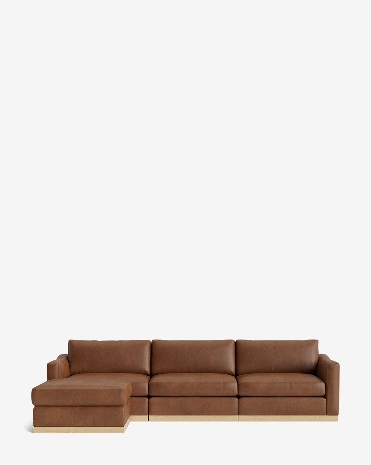 The Vernon Modular Sofa with Ottoman 121 is a modern brown leather sectional with a left-facing chaise lounge, shown against a plain white background by McGee & Co.