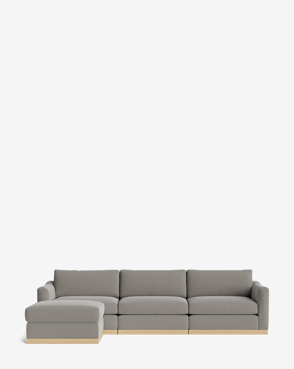 The Vernon Modular Sofa with Ottoman 121 is a modern gray sectional with clean lines, a left-side chaise, light wooden bases, and an ottoman, by McGee & Co. This customizable fabric sofa blends comfort and style against a plain white background.