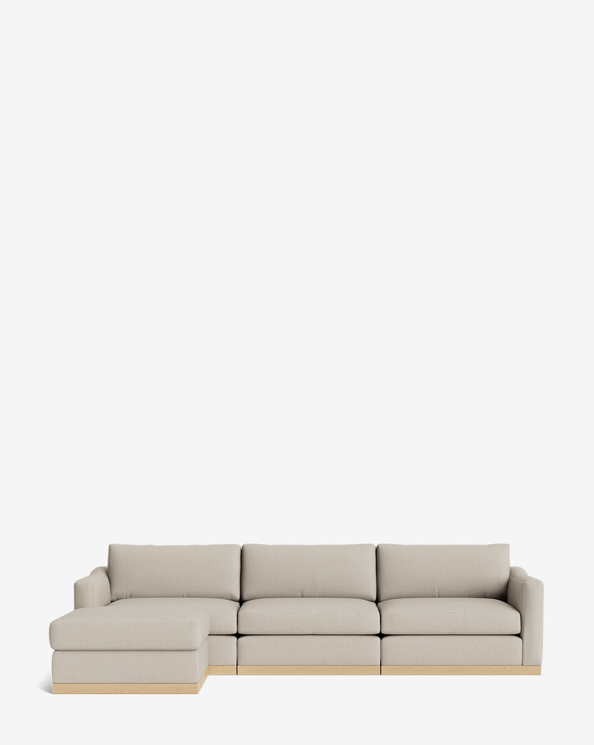 The Vernon Modular Sofa with Ottoman 121 features plush cushions and a light wood base, displayed against a white background—a customizable fabric sofa offering comfort and style, by McGee & Co.