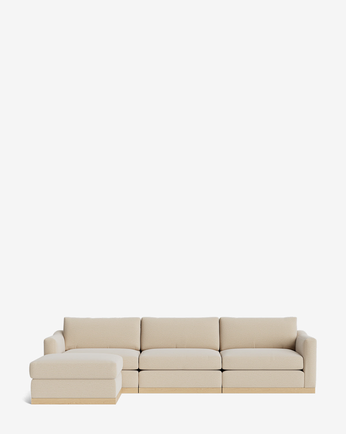 The Vernon Modular Sofa with Ottoman 121 is a beige sectional with a left-facing chaise, wooden base, and modern lines on a white background. This customizable fabric sofa combines comfort and contemporary style by McGee & Co.